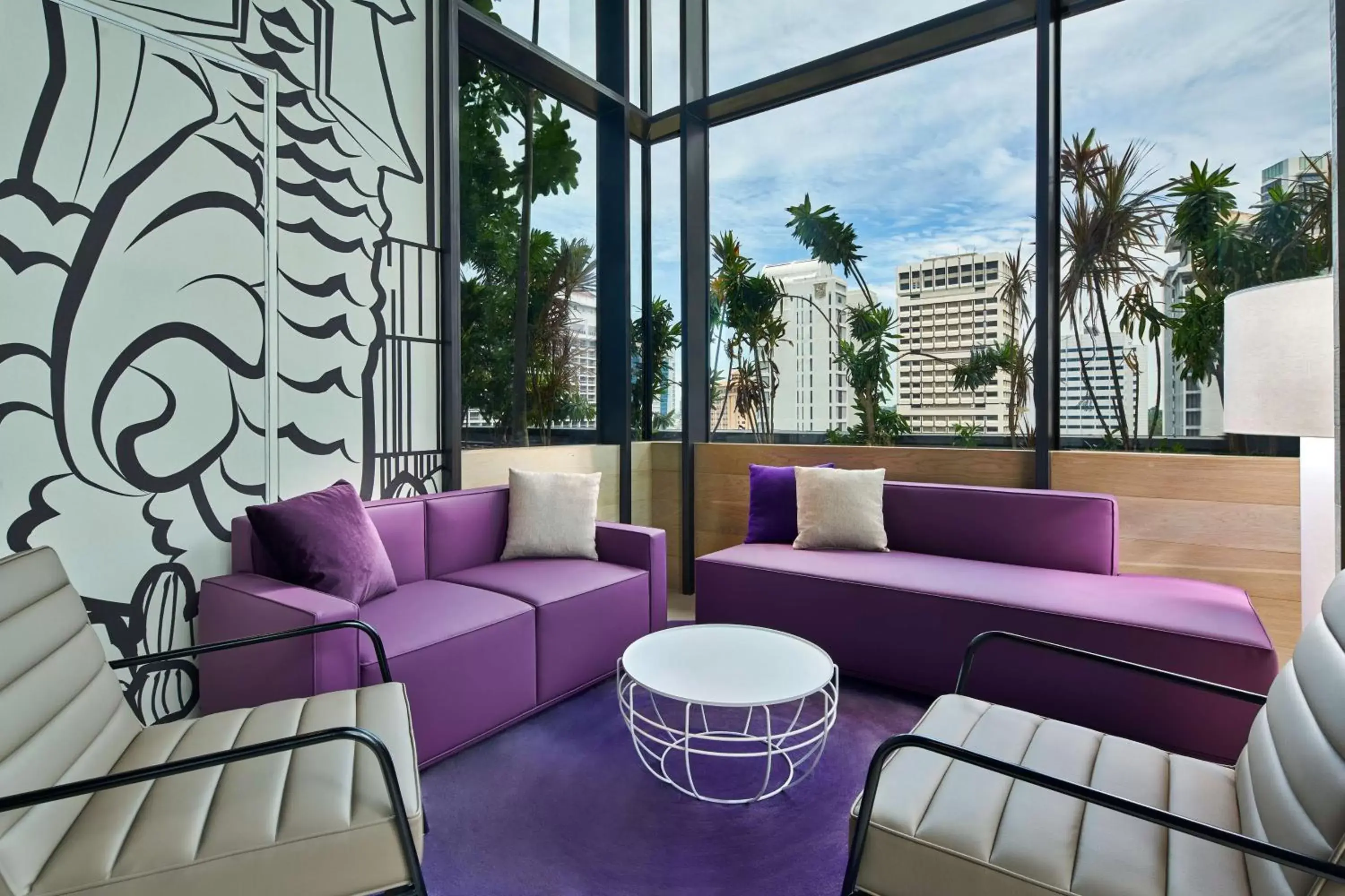 Communal lounge/ TV room in YOTEL Singapore Orchard Road