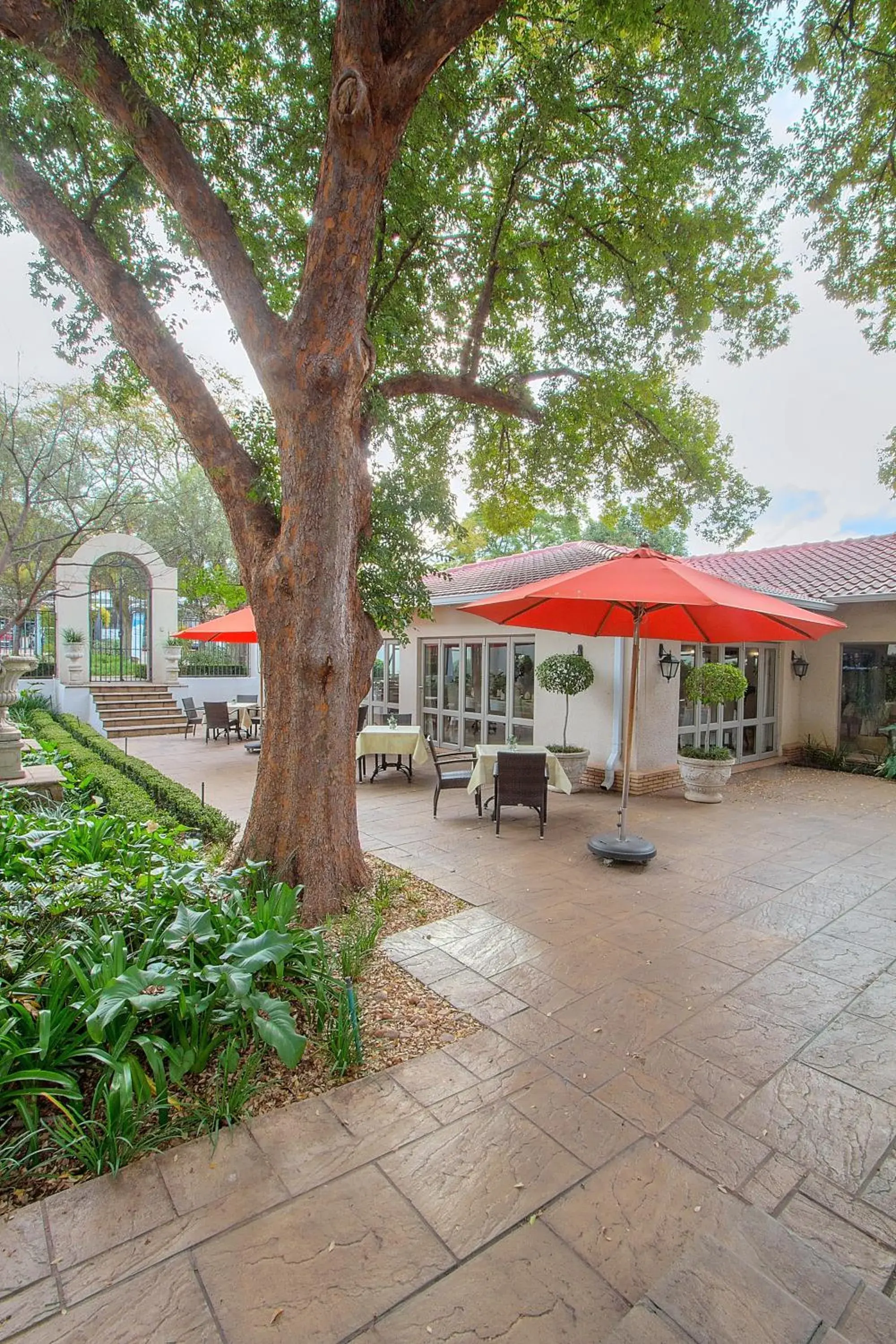 Patio, Property Building in The Syrene Boutique Hotel