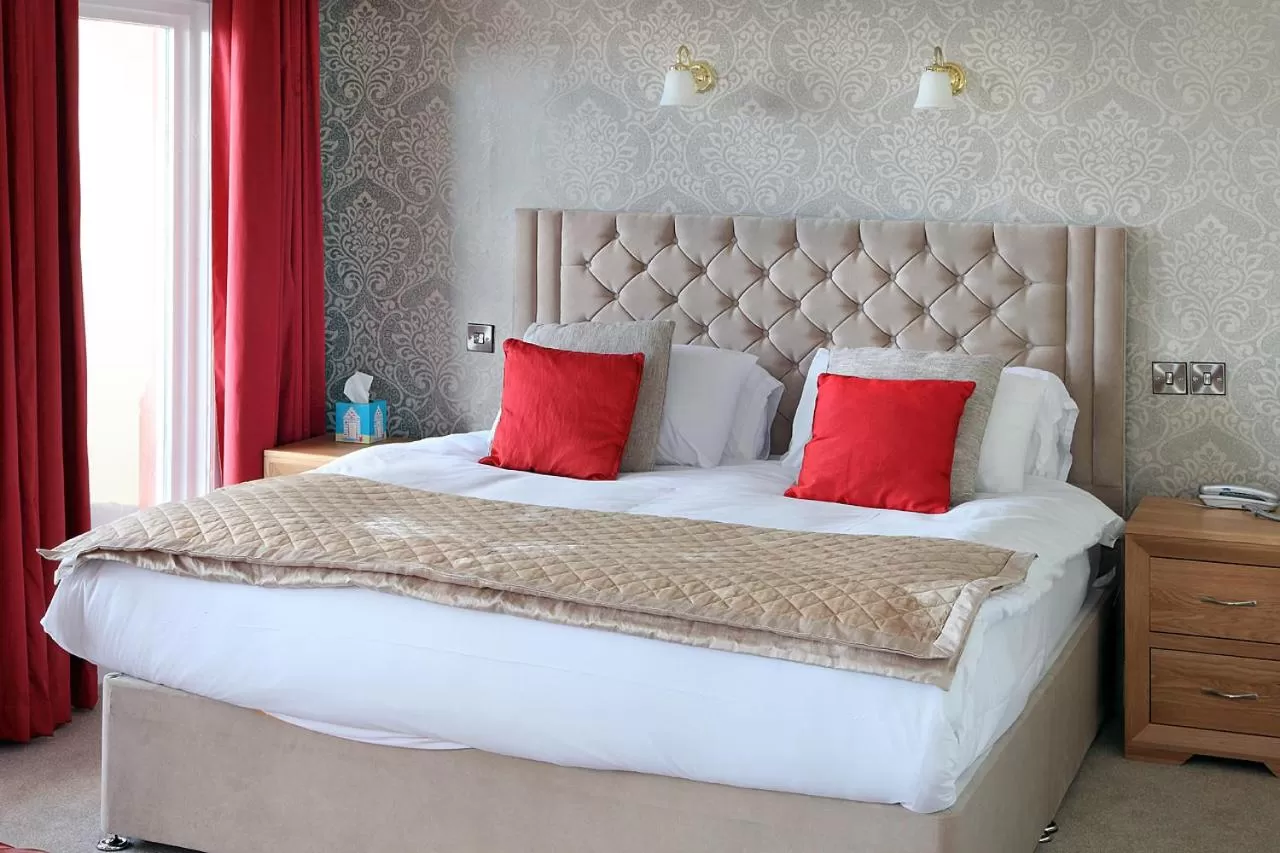 Bed in The Marine Hotel