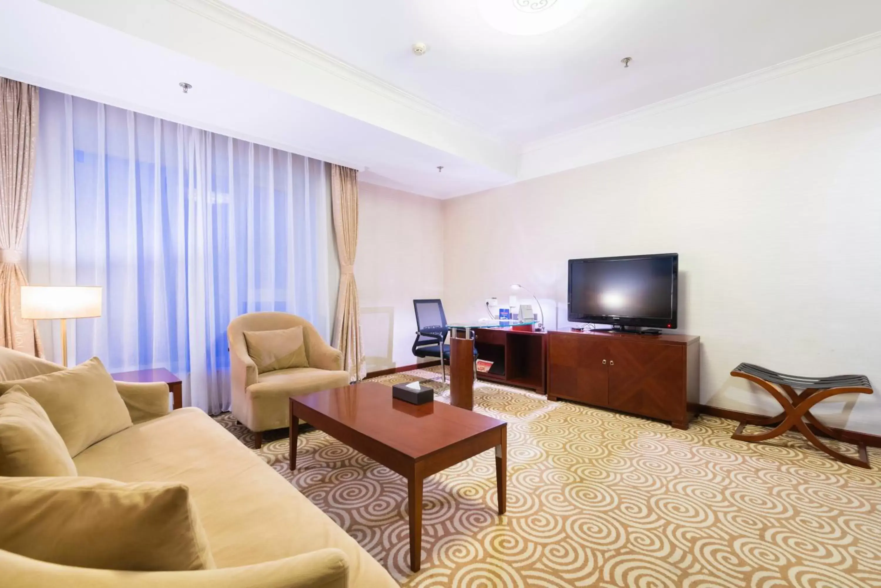 Photo of the whole room, Seating Area in Inner Mongolia Grand Hotel