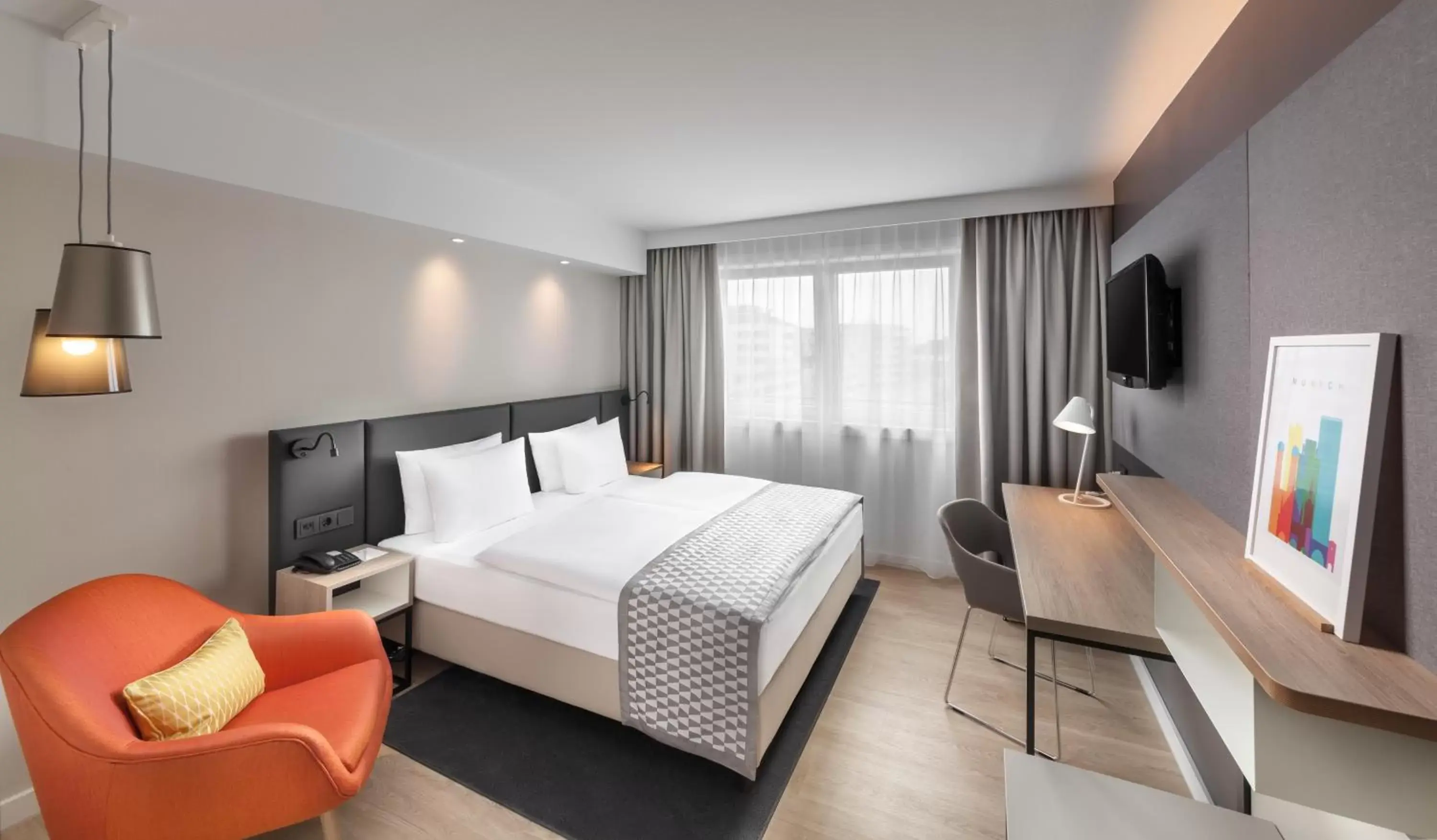 Bed in Holiday Inn Munich City Centre, an IHG Hotel