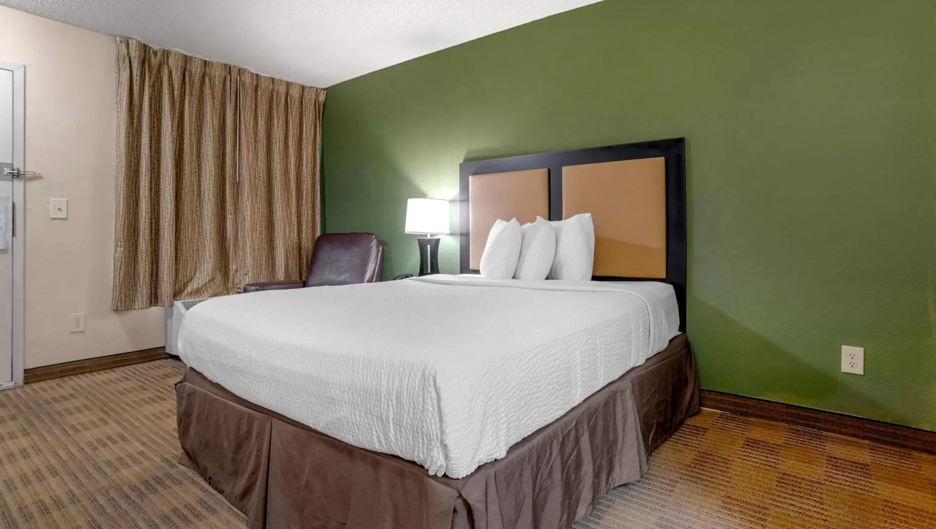 Bedroom, Bed in Home 1 Suites Extended Stay