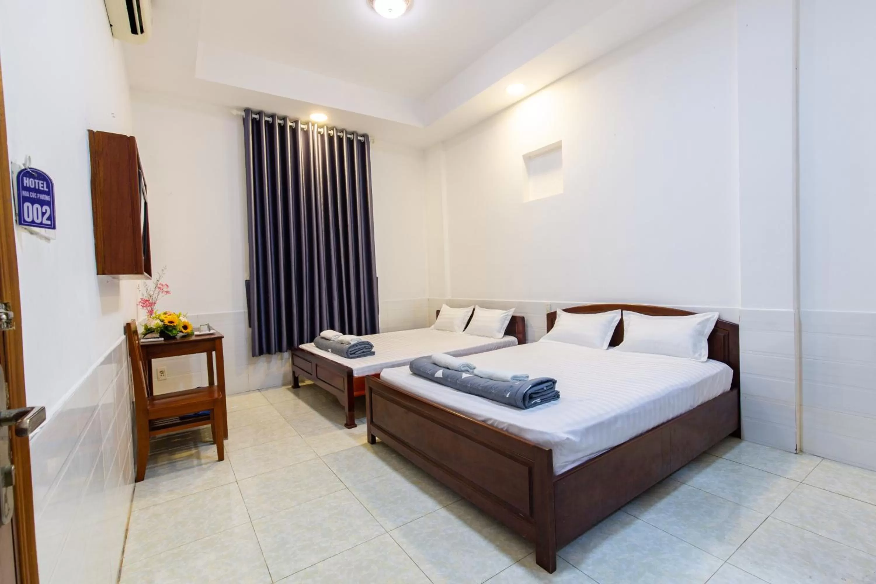 Bed in Hotel Hoa Cúc Phương Dĩ An - Bình Dương