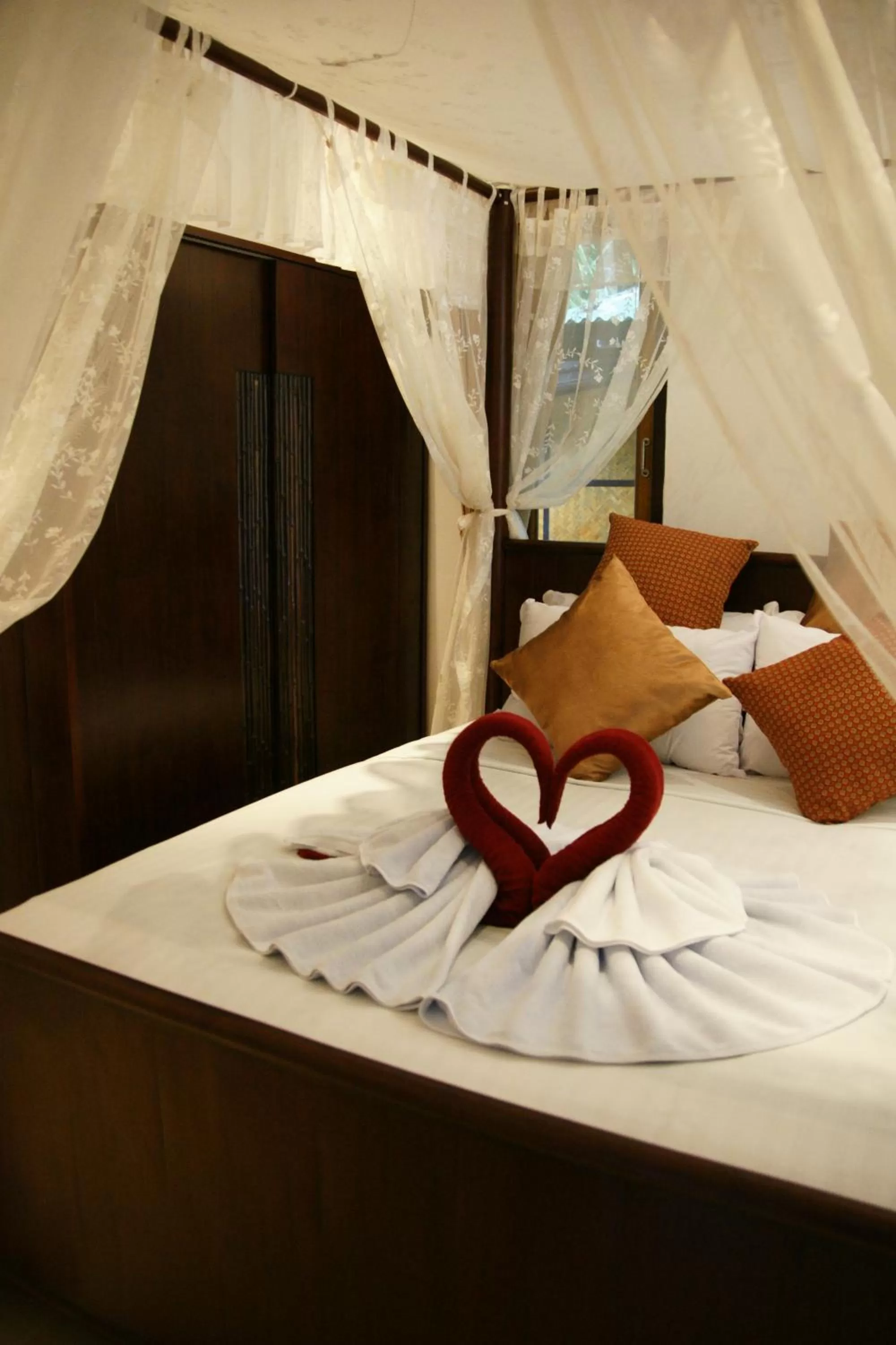 Bed in Jungle Village Bungalow