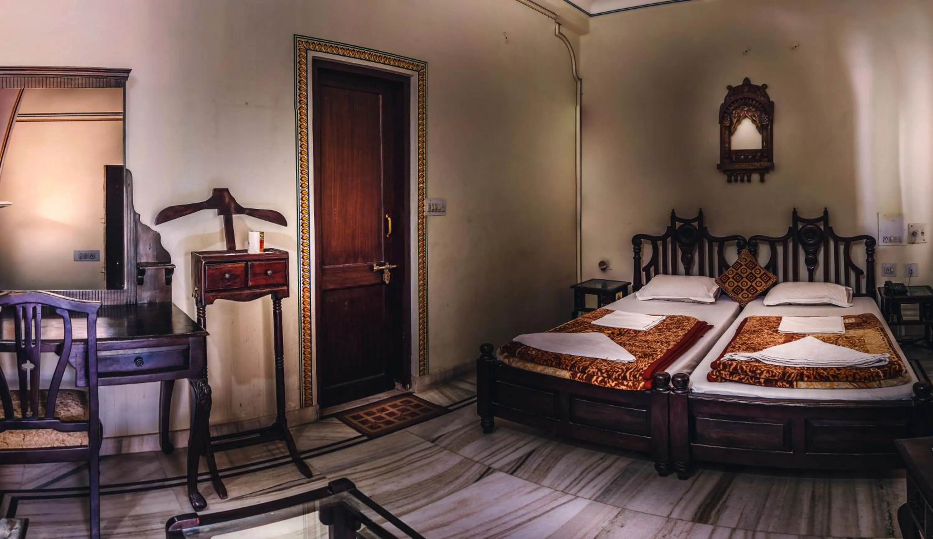 Bed in Krishna Palace - A Heritage Boutique Hotel