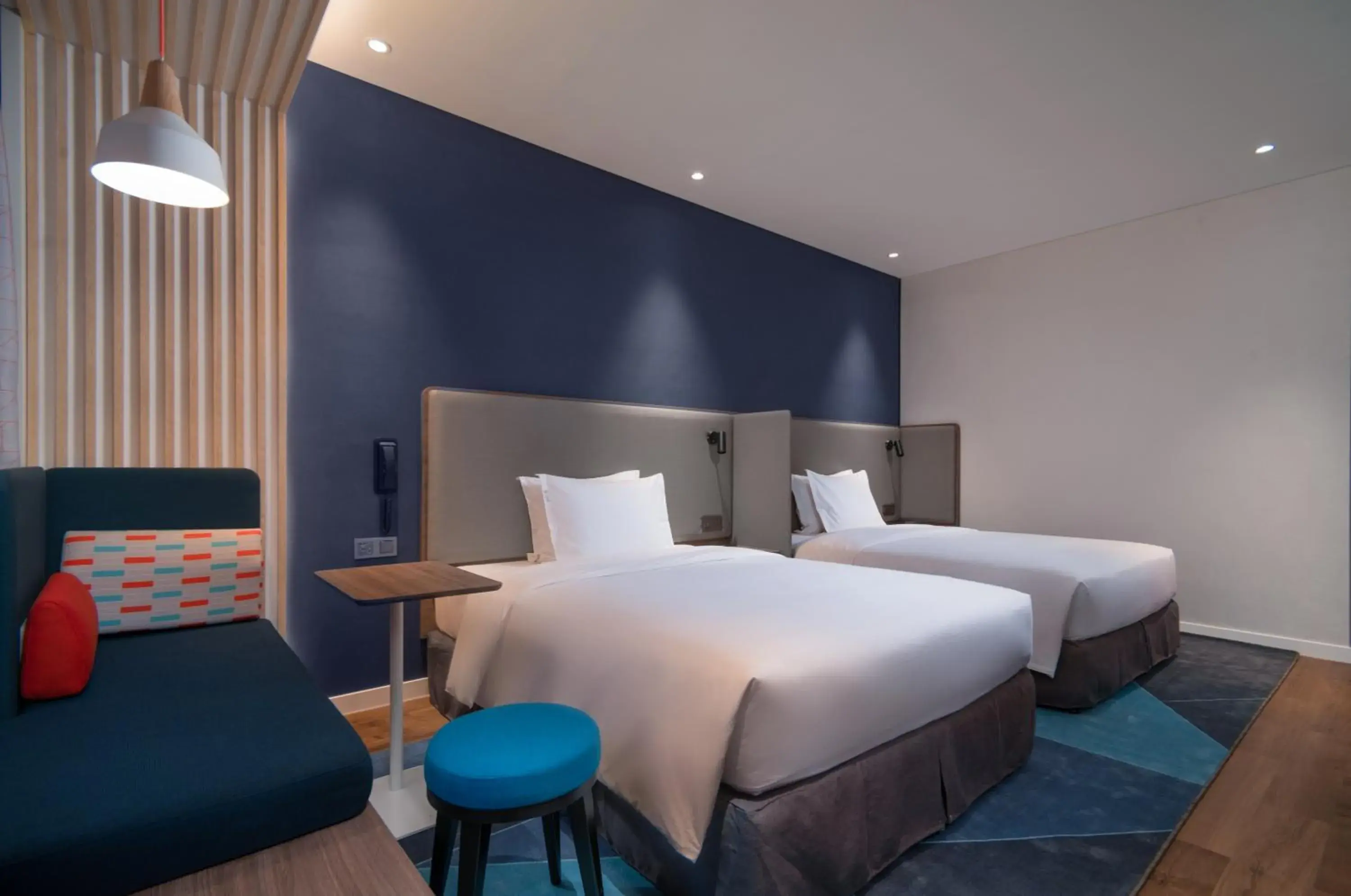 Bed in Holiday Inn Express Jinjiang Anhai, an IHG Hotel