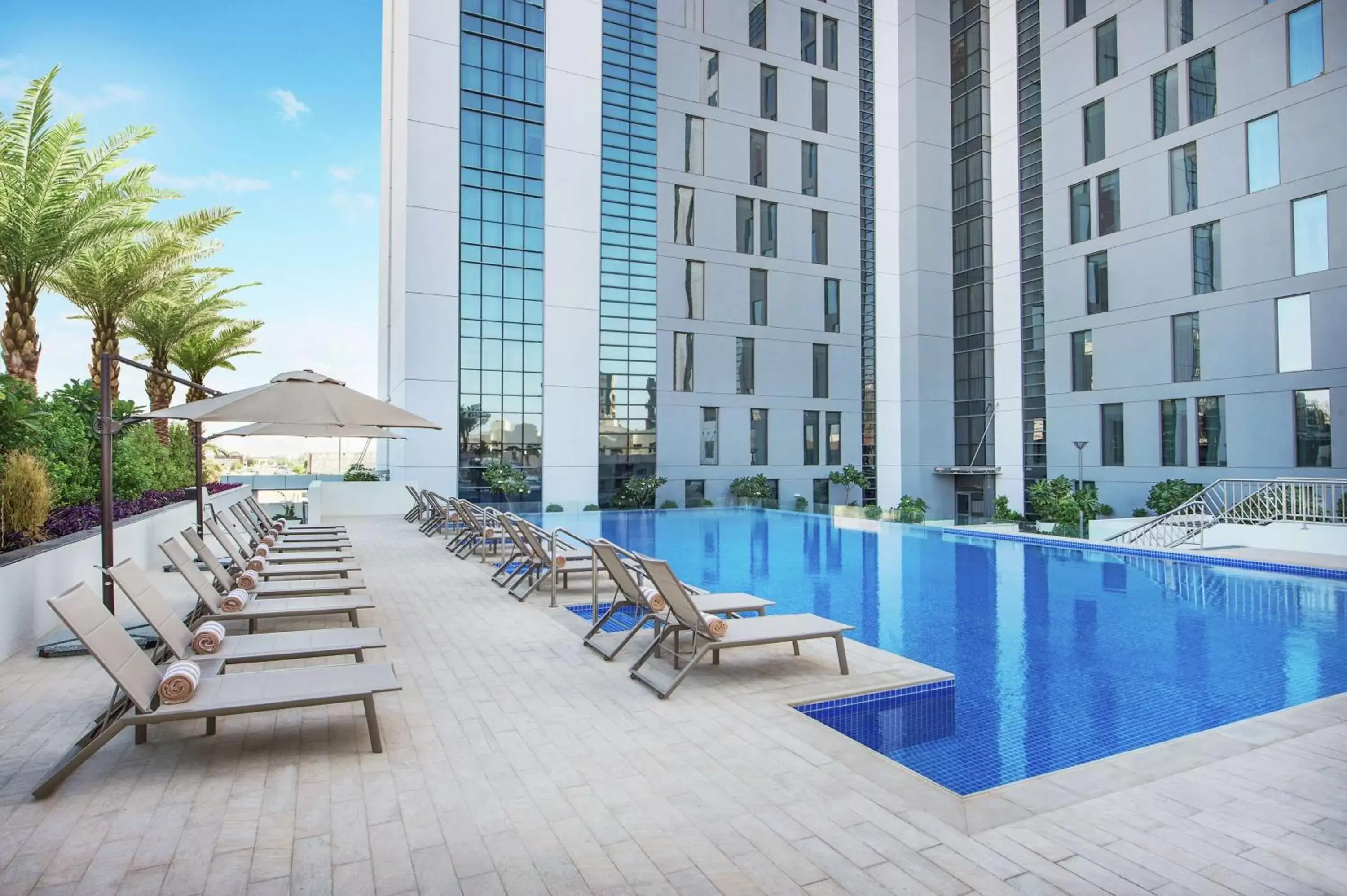 Property building, Swimming Pool in Hampton By Hilton Dubai Airport