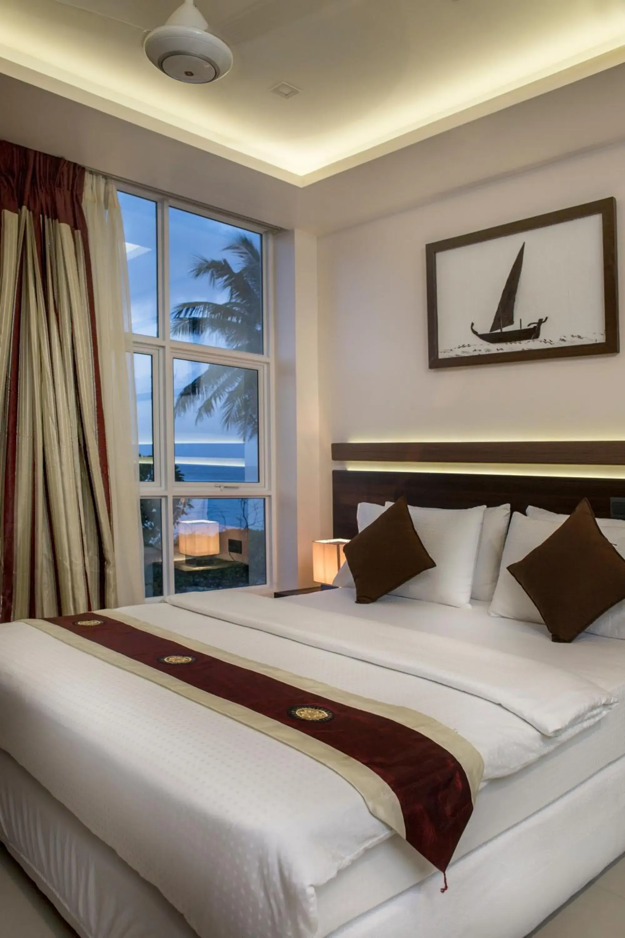 Bed in The White Harp Beach Hotel