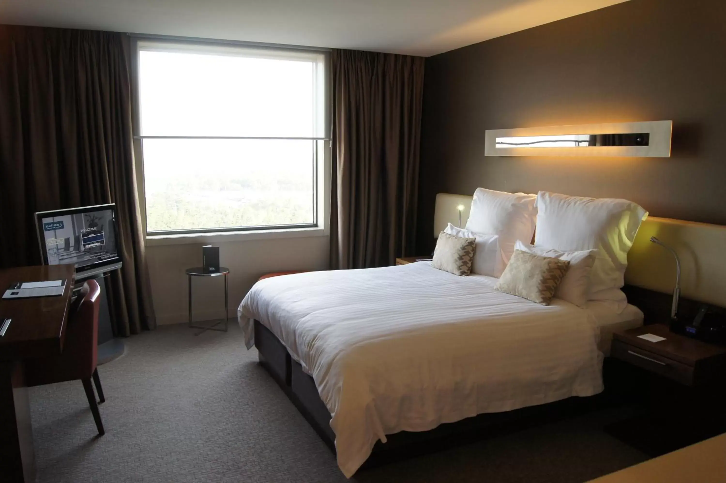 Bed in Pullman at Sydney Olympic Park Hotel