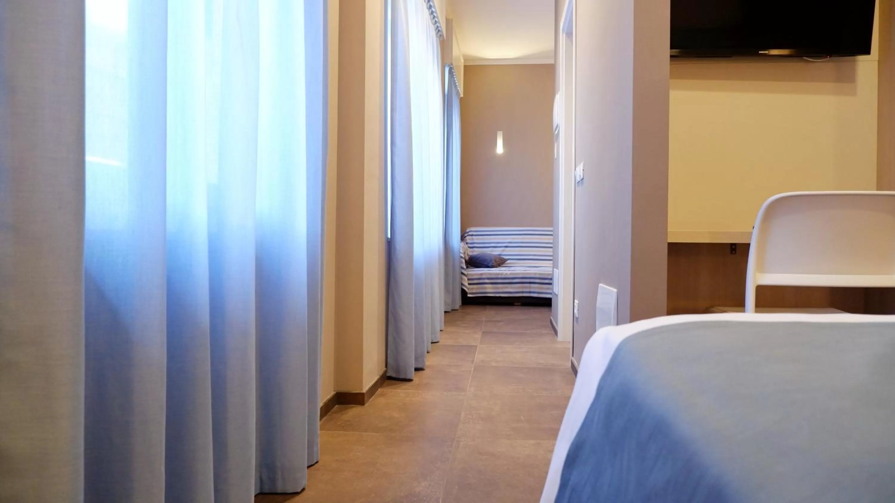 TV/Entertainment Center in Pianomare Riviera Apartments and Rooms