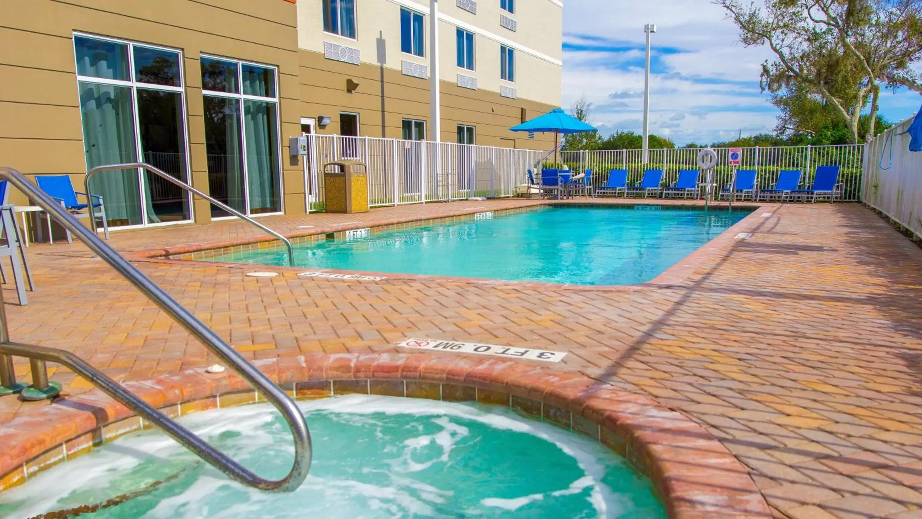 Swimming Pool in Holiday Inn Express Hotel & Suites Palm Bay, an IHG Hotel