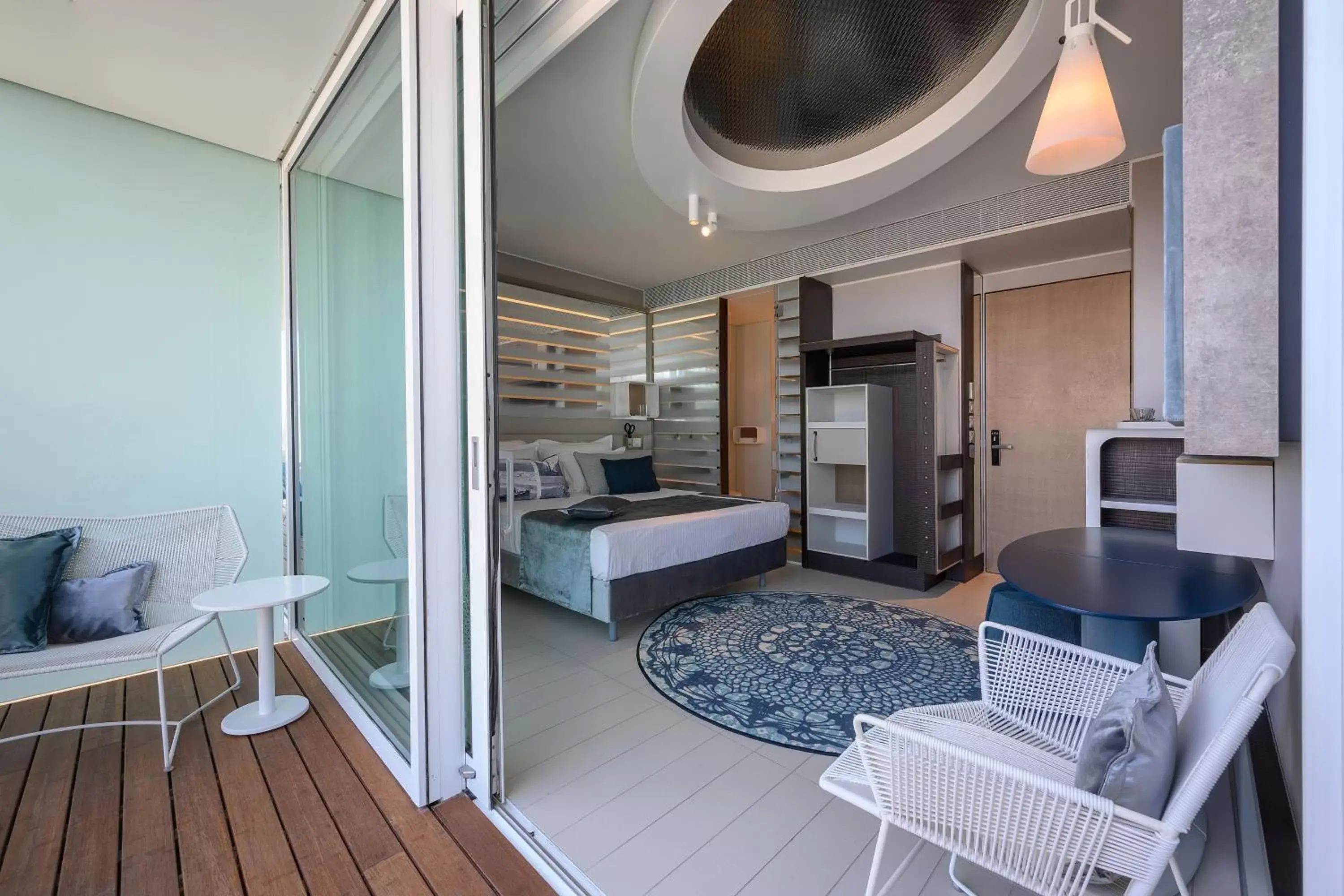 Seating area, Bed in Port Tower by Isrotel Design Seating area, Bed in Port Tower by Isrotel Design