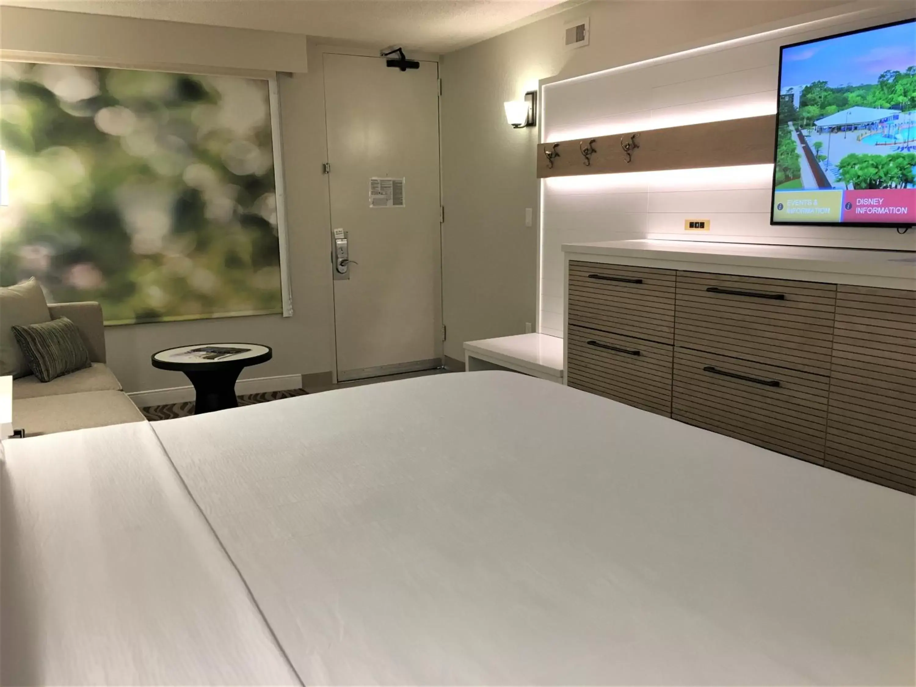 Communal lounge/ TV room, Bed in Wyndham Garden Lake Buena Vista Disney Springs® Resort Area