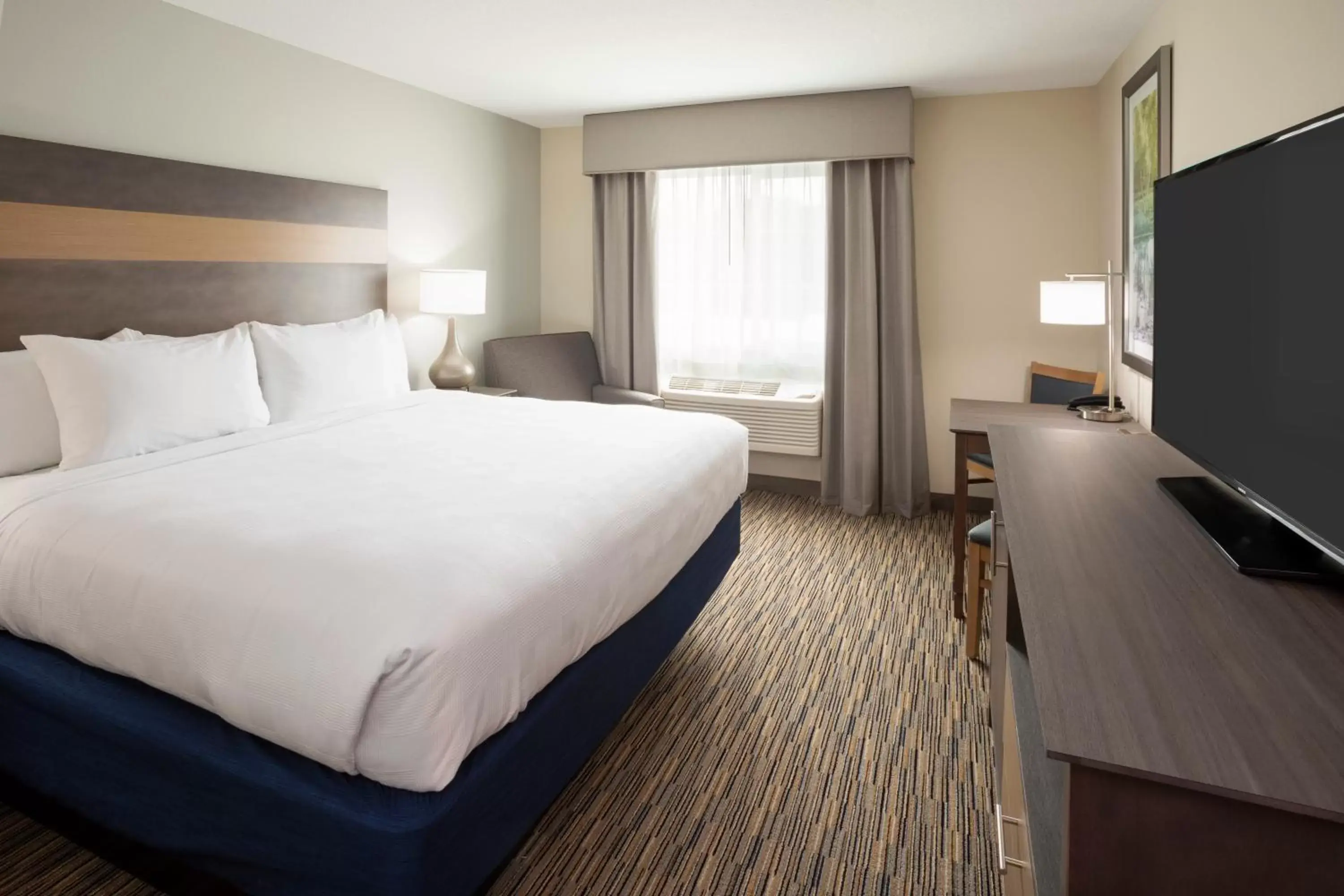 Bed in GrandStay Hotel & Suites