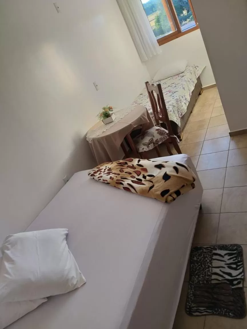 Bed in Hotel Pousada Rolantchê