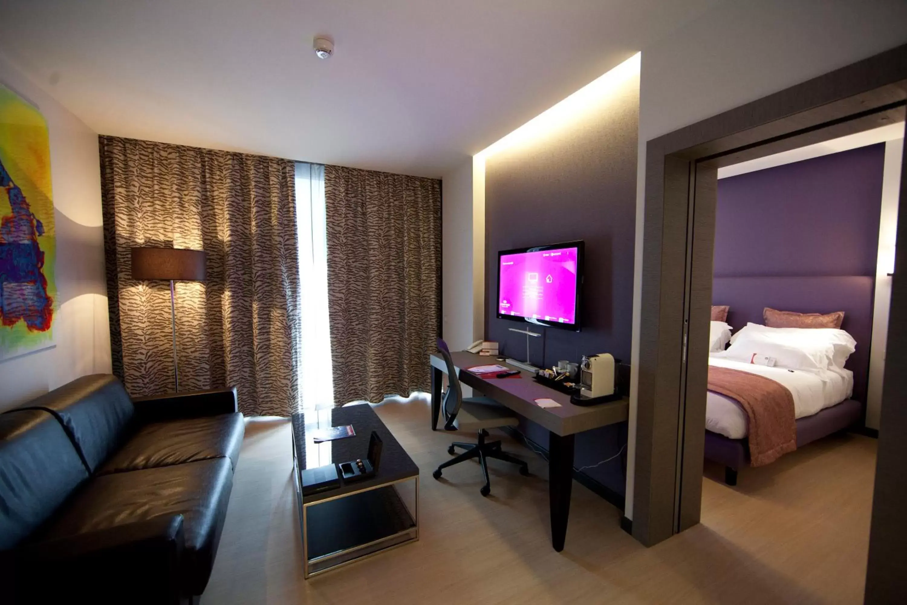 Bedroom, TV/Entertainment Center in Crowne Plaza Verona Fiera, an IHG Hotel