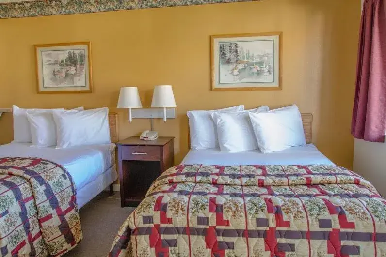 Bed in California Suites Hotel