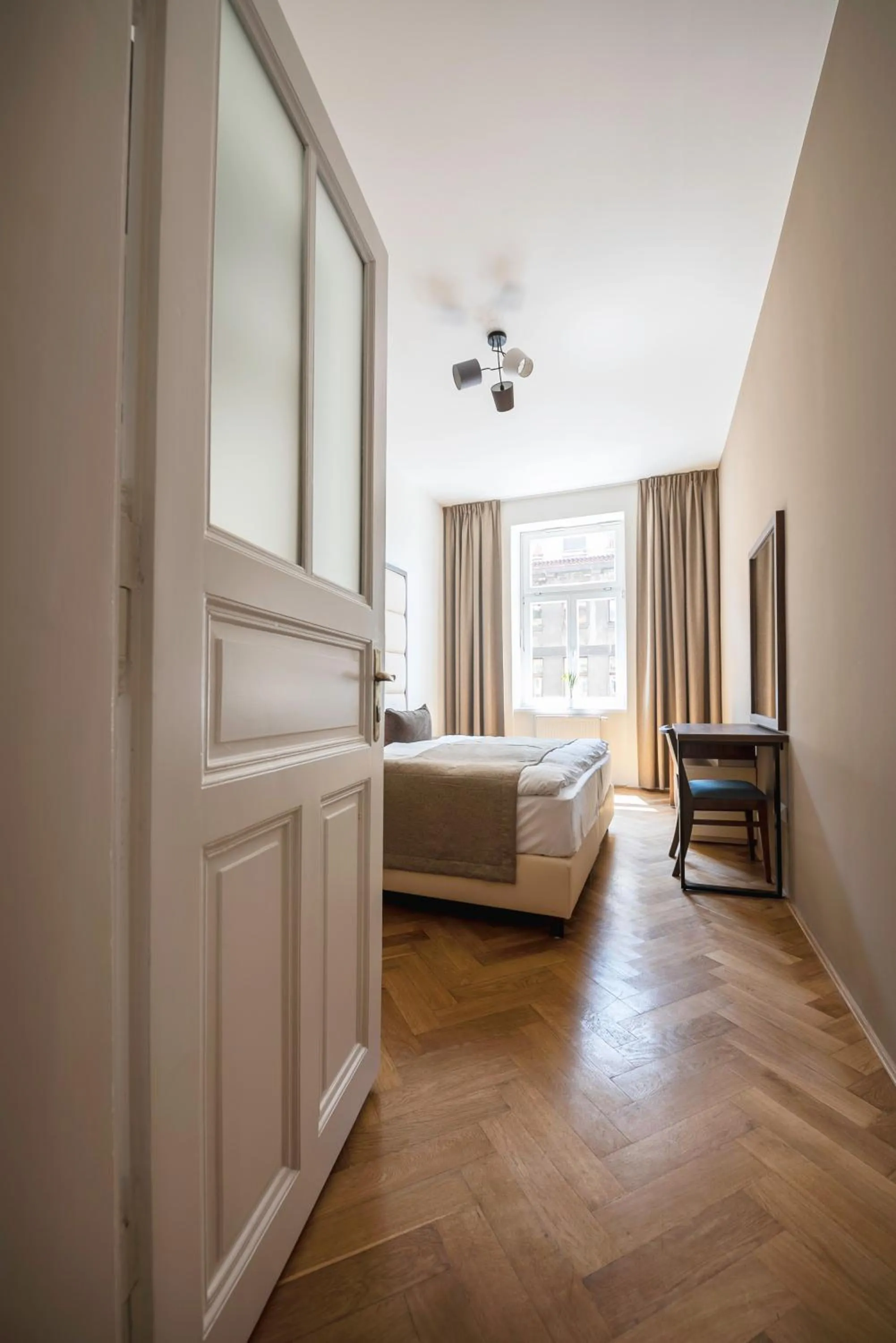 Bed in Letna Garden Suites