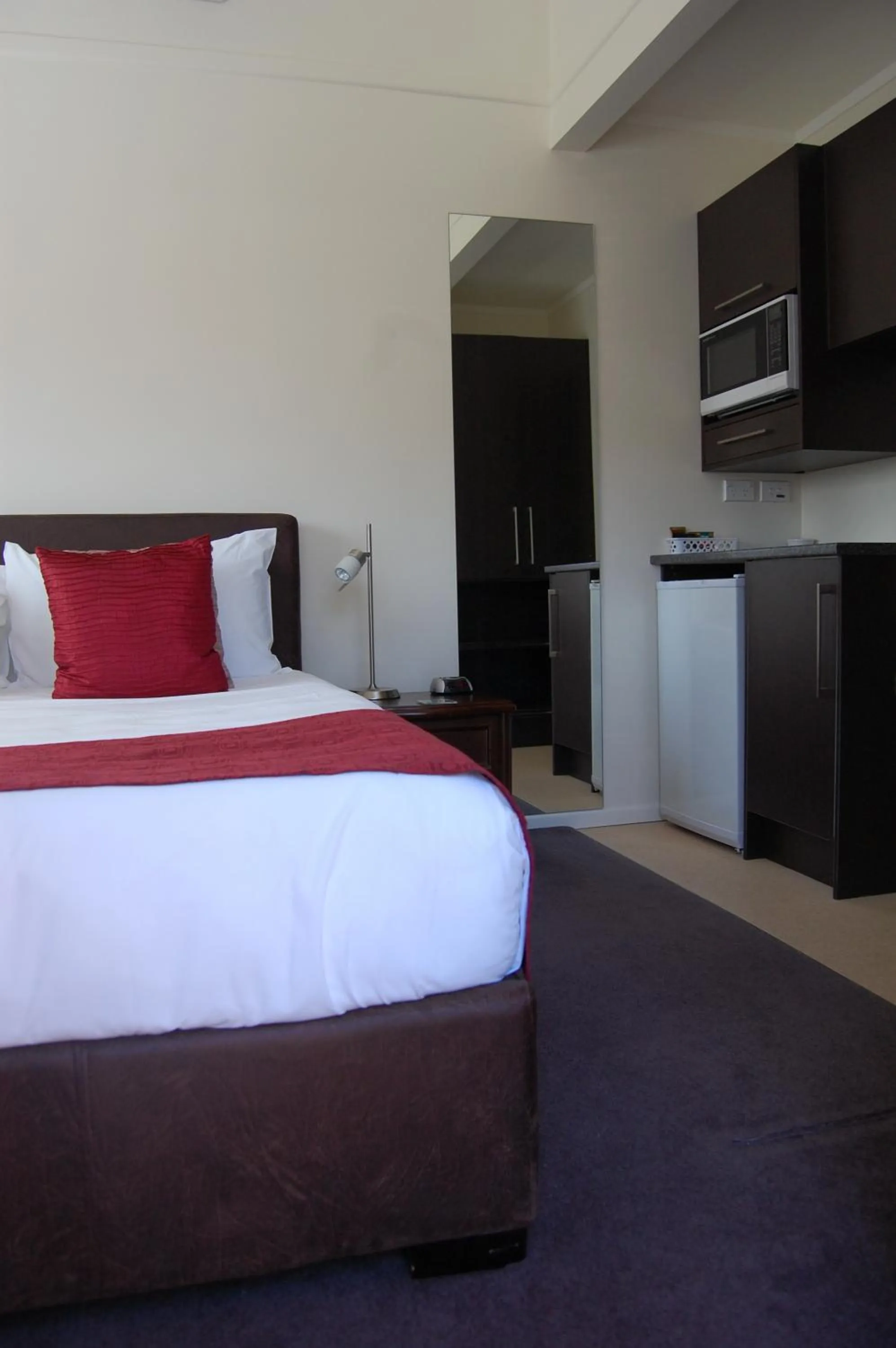 Bed in At Eden Park Motel