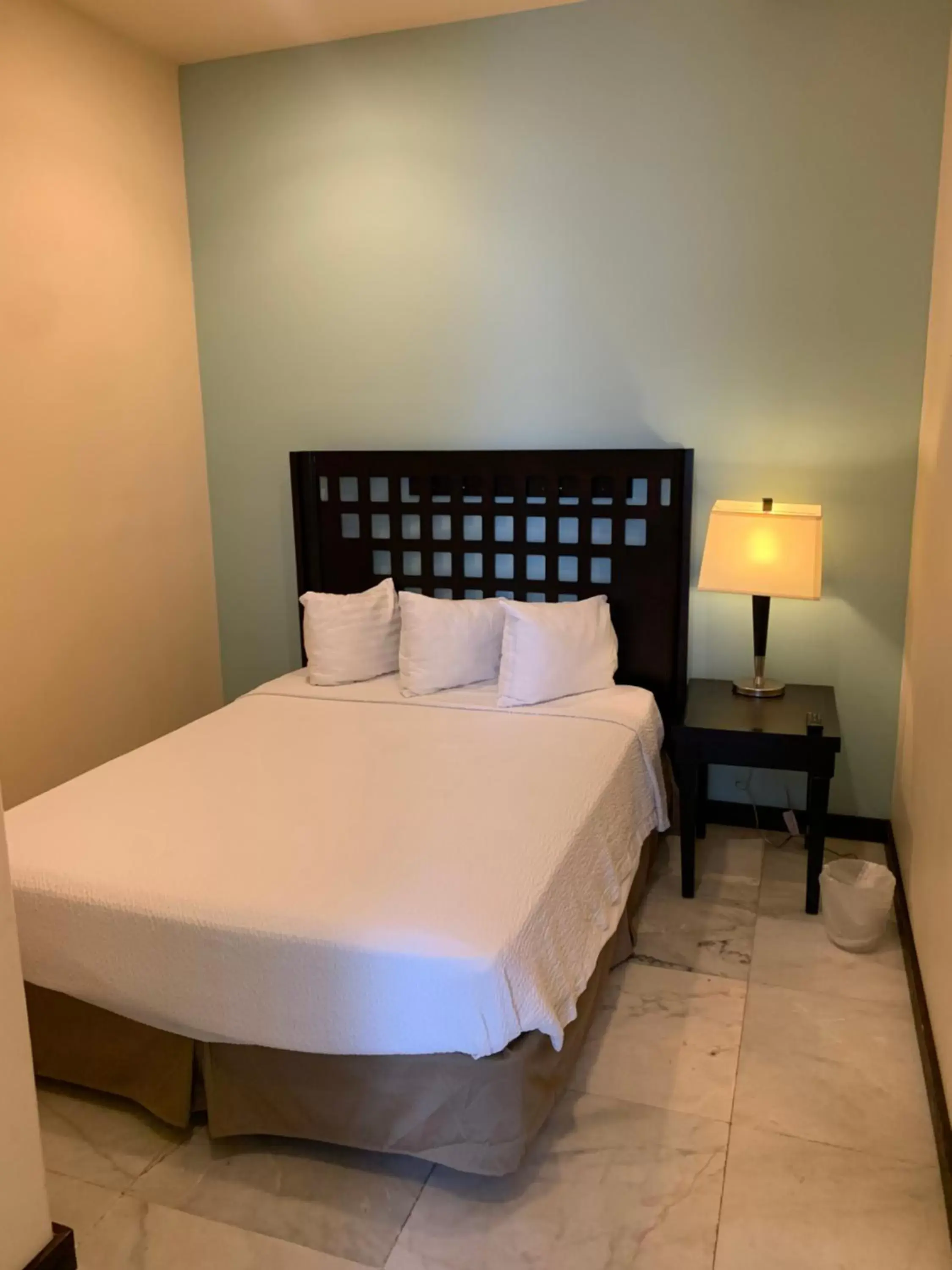 Bed in Sunchase Inn & Suites Bed in Sunchase Inn & Suites