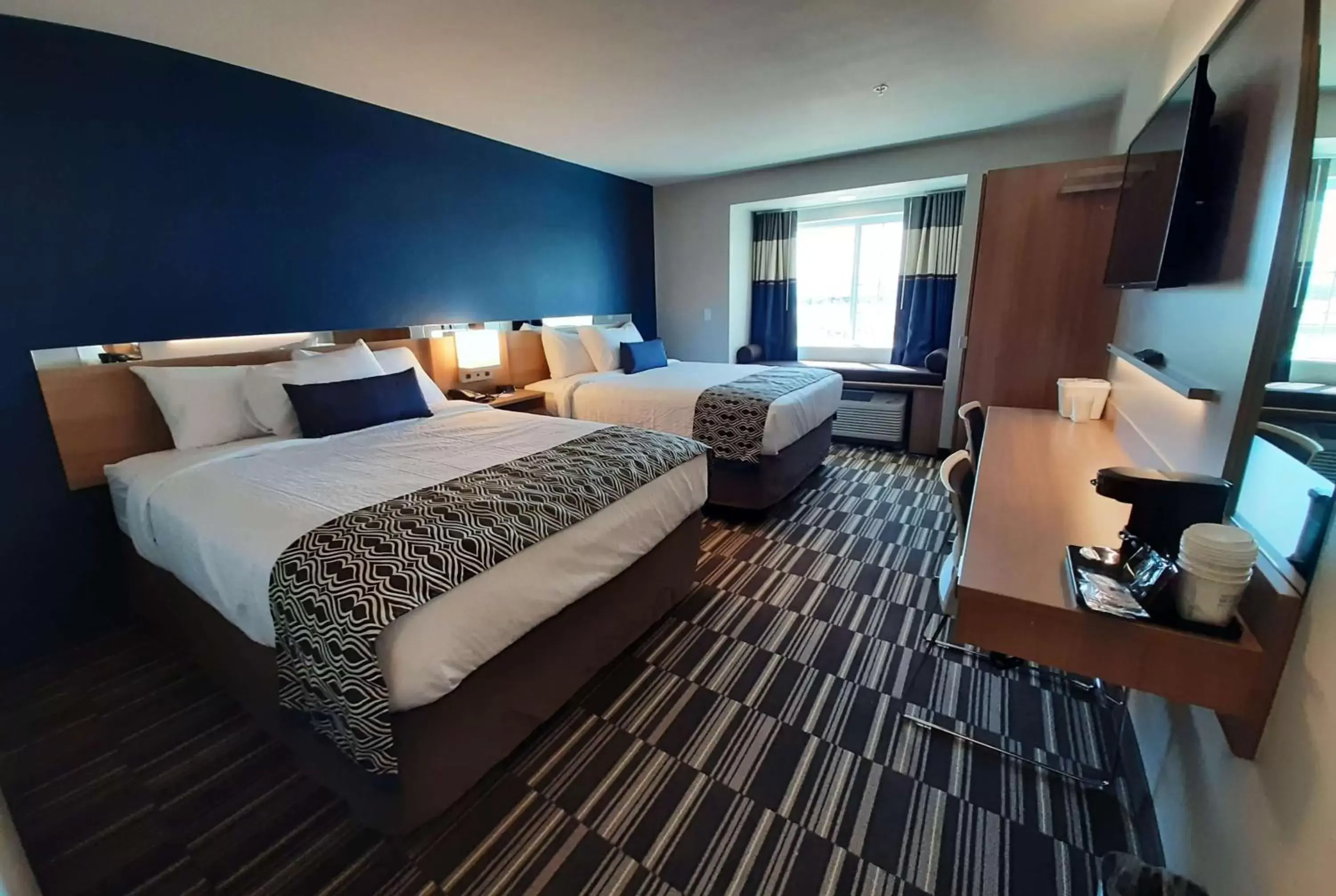 Bed in Microtel Inn & Suites by Wyndham Loveland