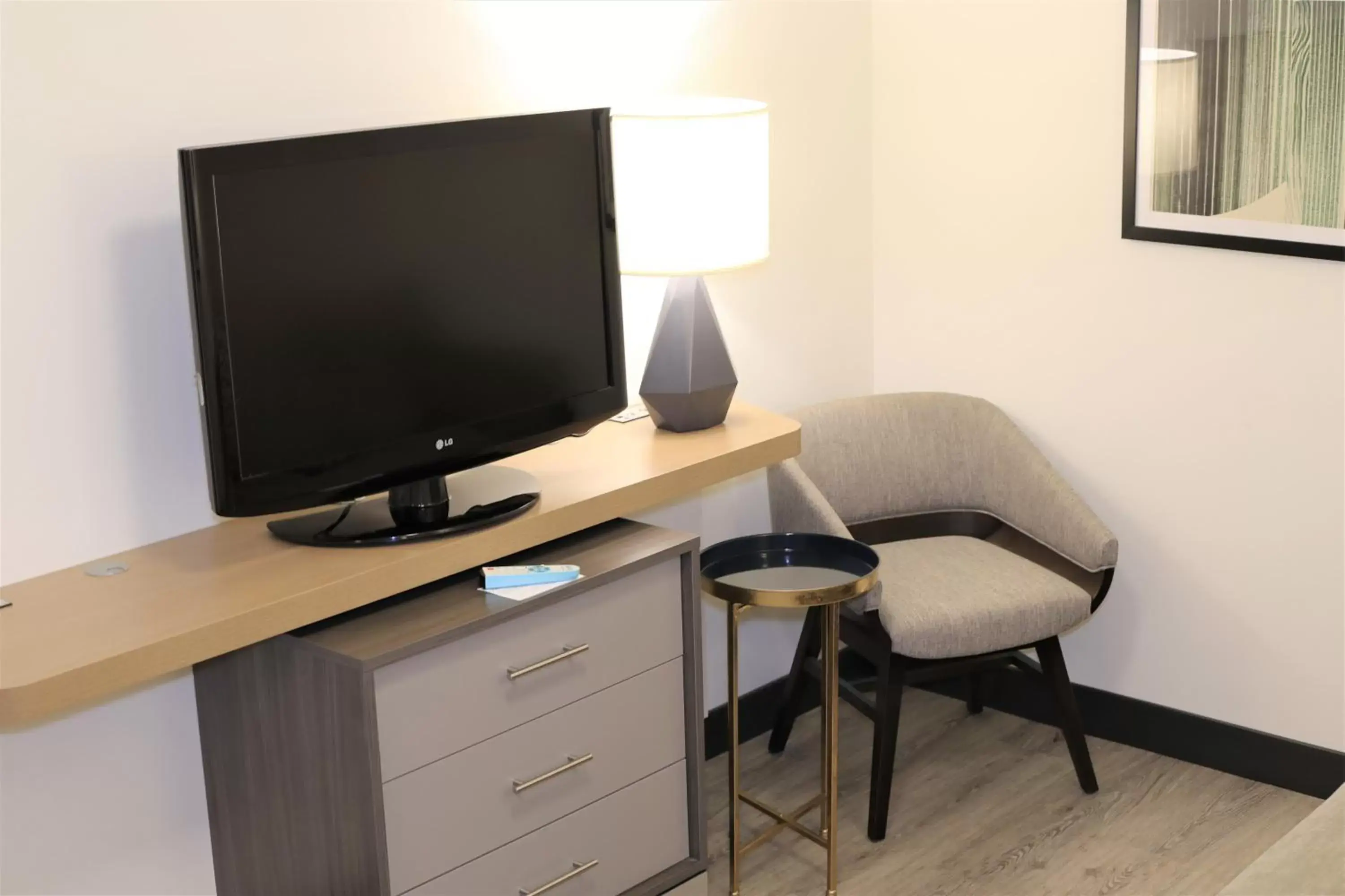 Photo of the whole room, TV/Entertainment Center in Holiday Inn & Suites St. Cloud, an IHG Hotel