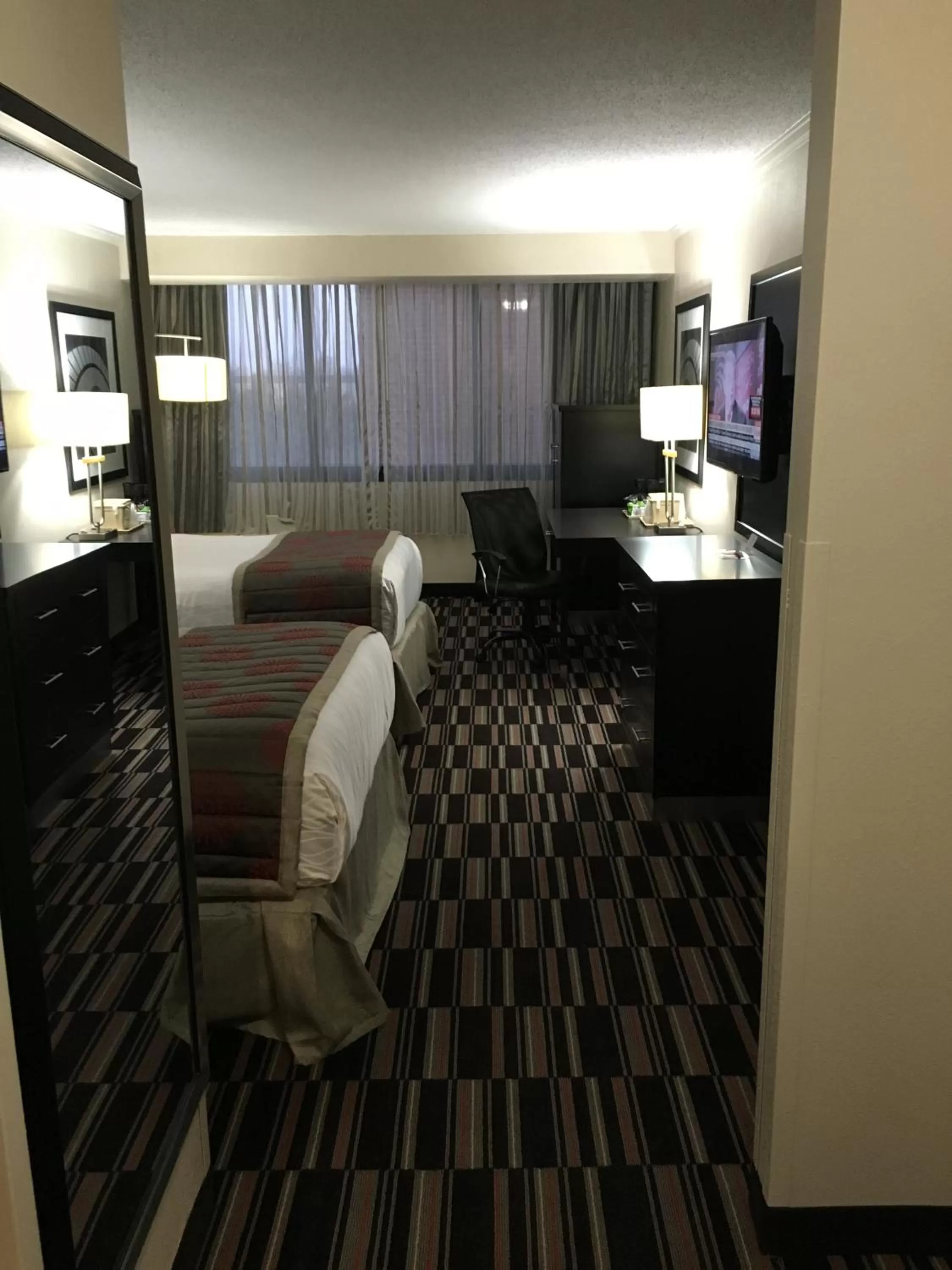 Bed in Ramada Plaza by Wyndham Charlotte South End Airport