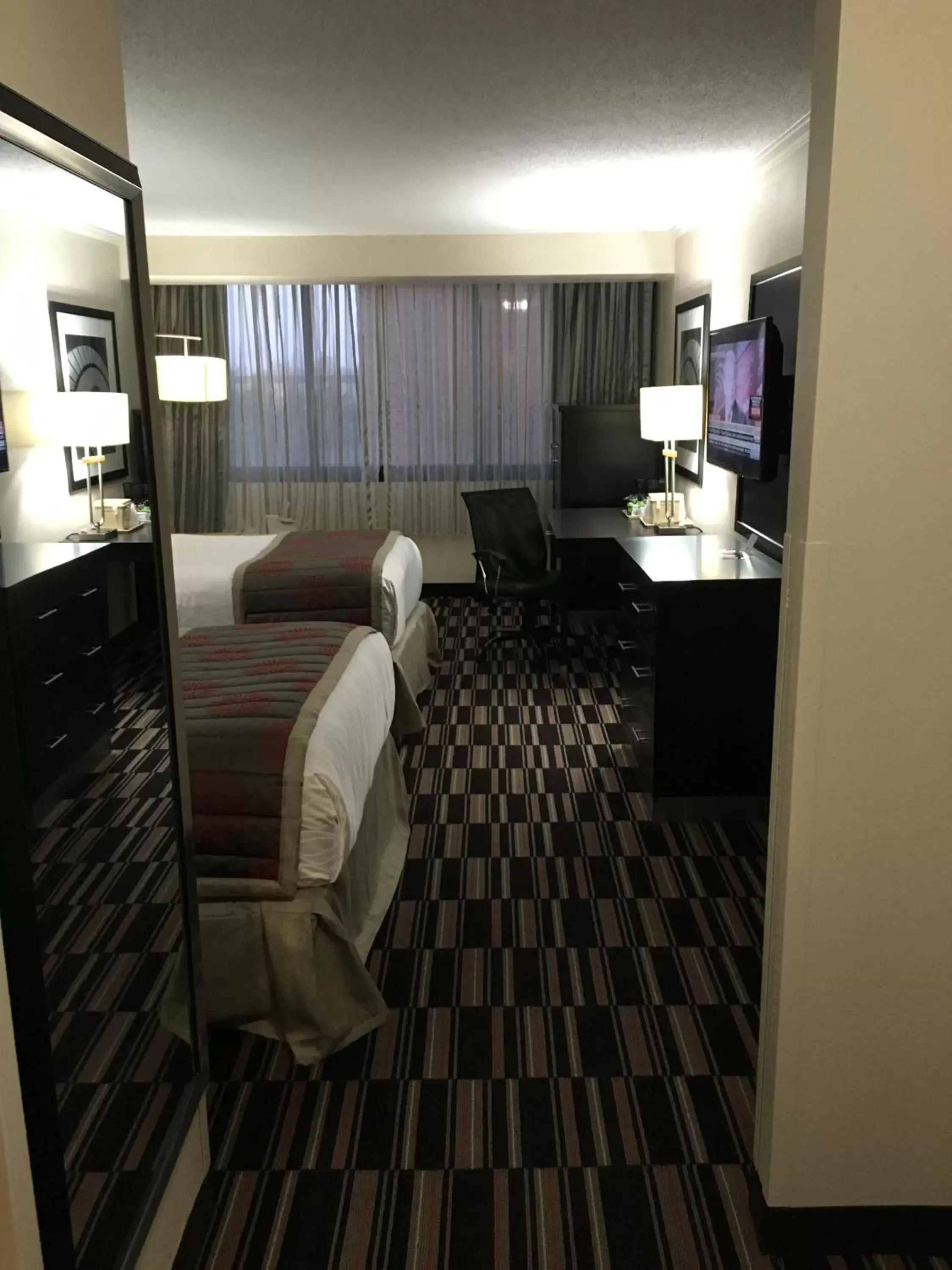 Bed, Seating Area in Ramada Plaza by Wyndham Charlotte South End Airport