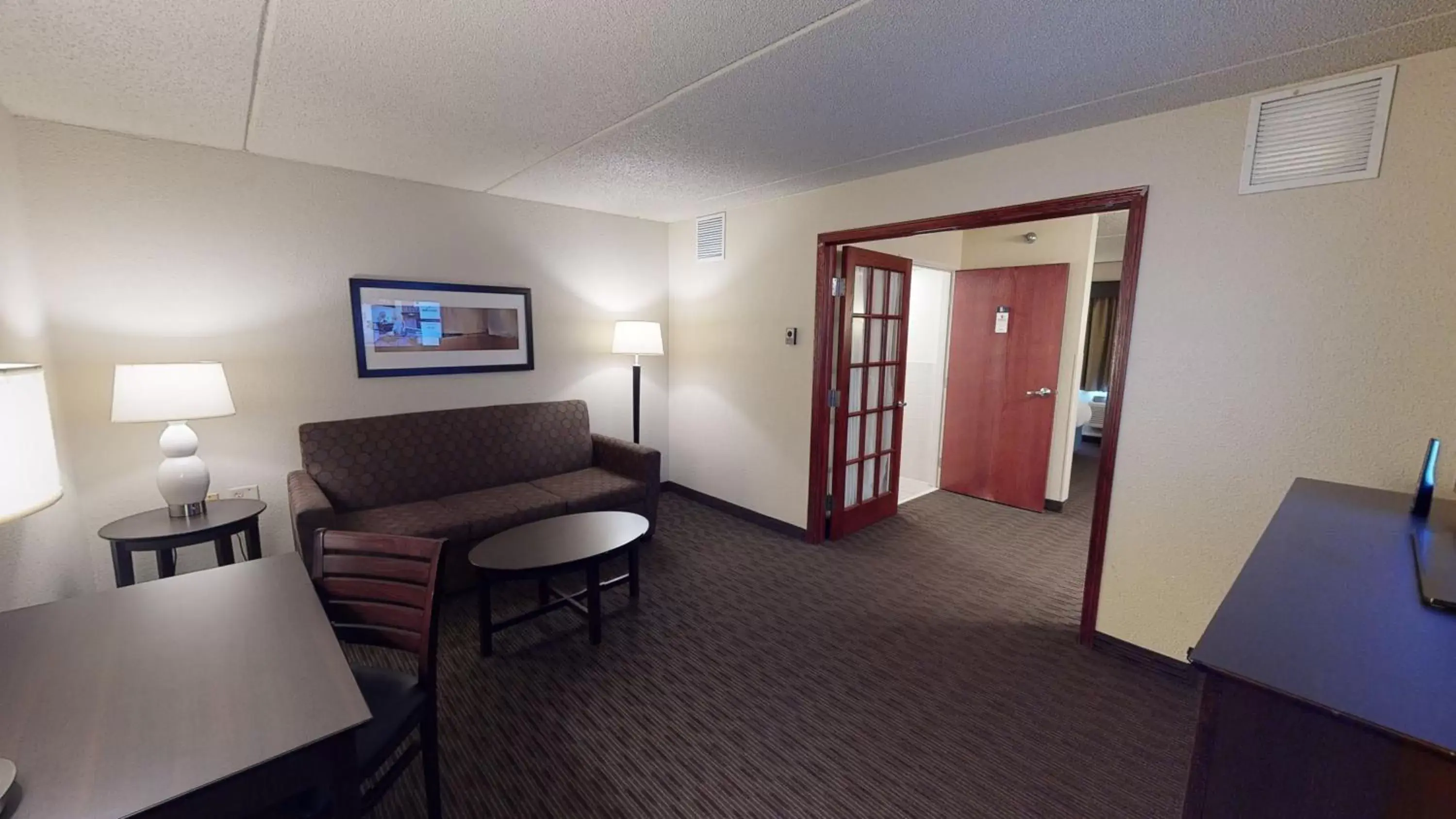 Living room, Seating Area in AmericInn by Wyndham Mounds View Minneapolis