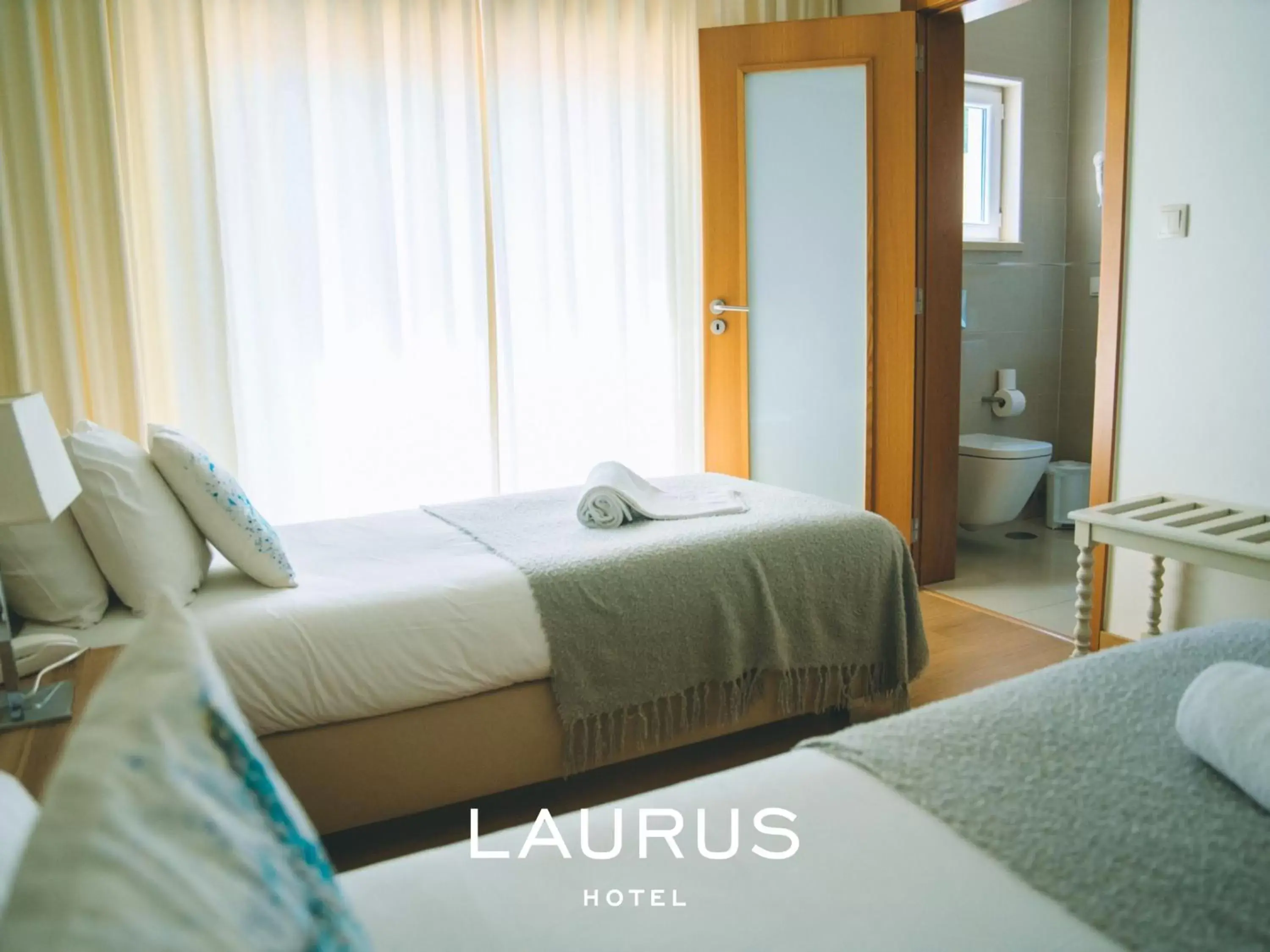 Bed in Laurus Hotel