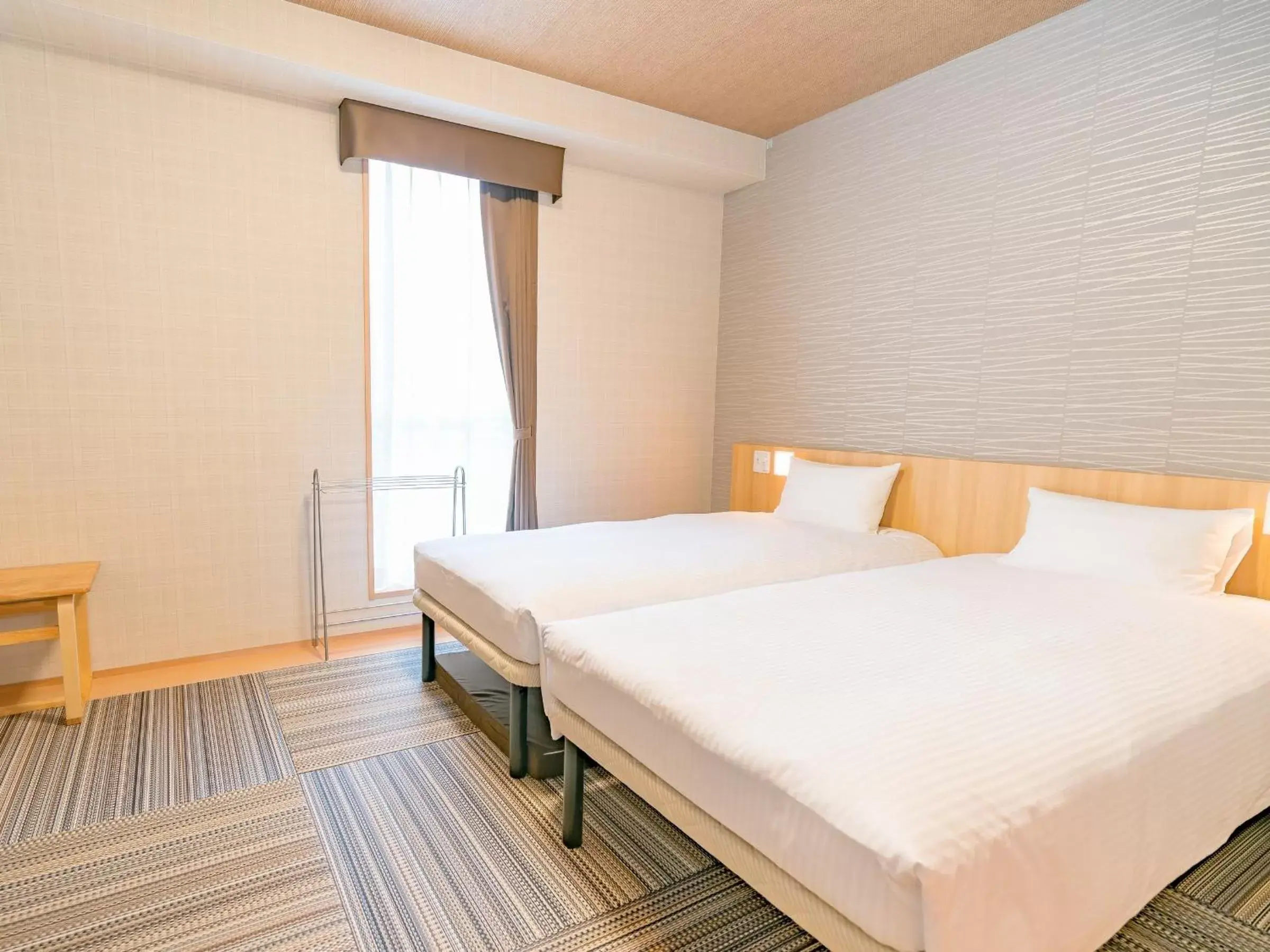 Bed in TABINO HOTEL Sado