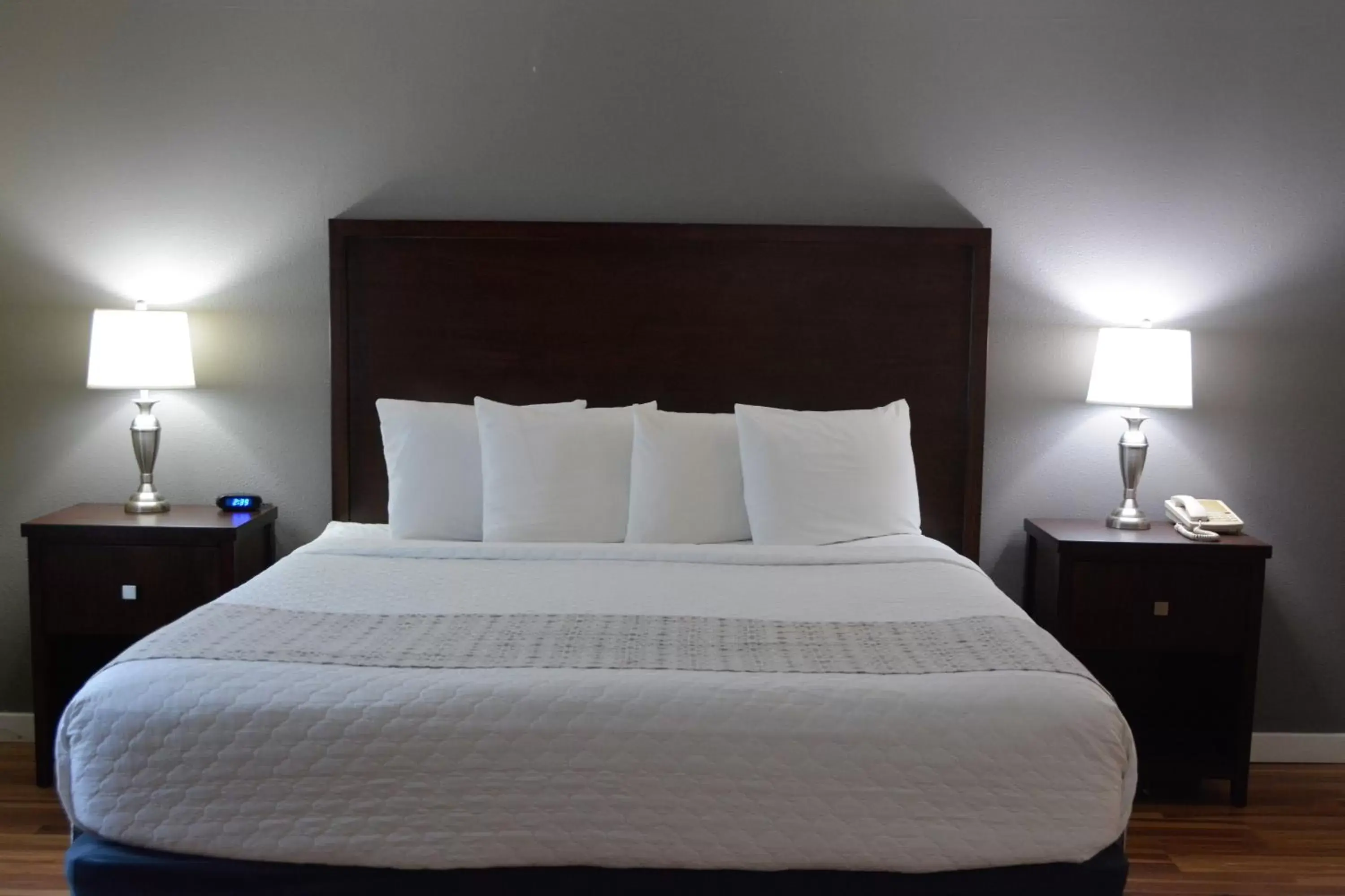 Bed in FairBridge Inn & Suites DuPont