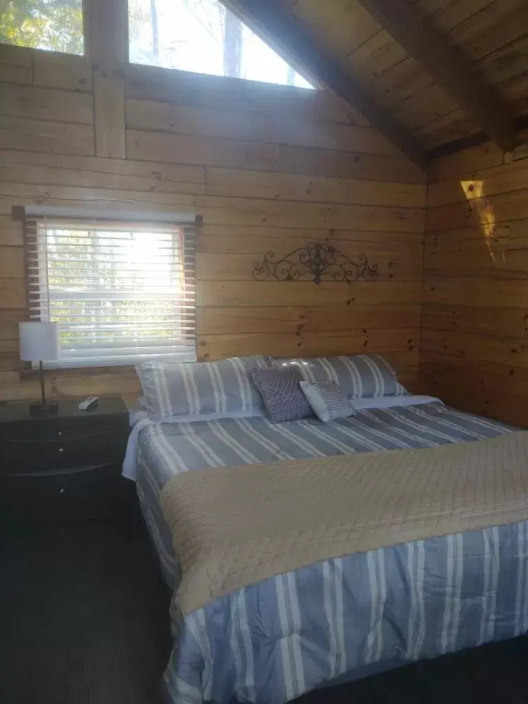 Bed in Kozy Haven Log Cabin Rentals