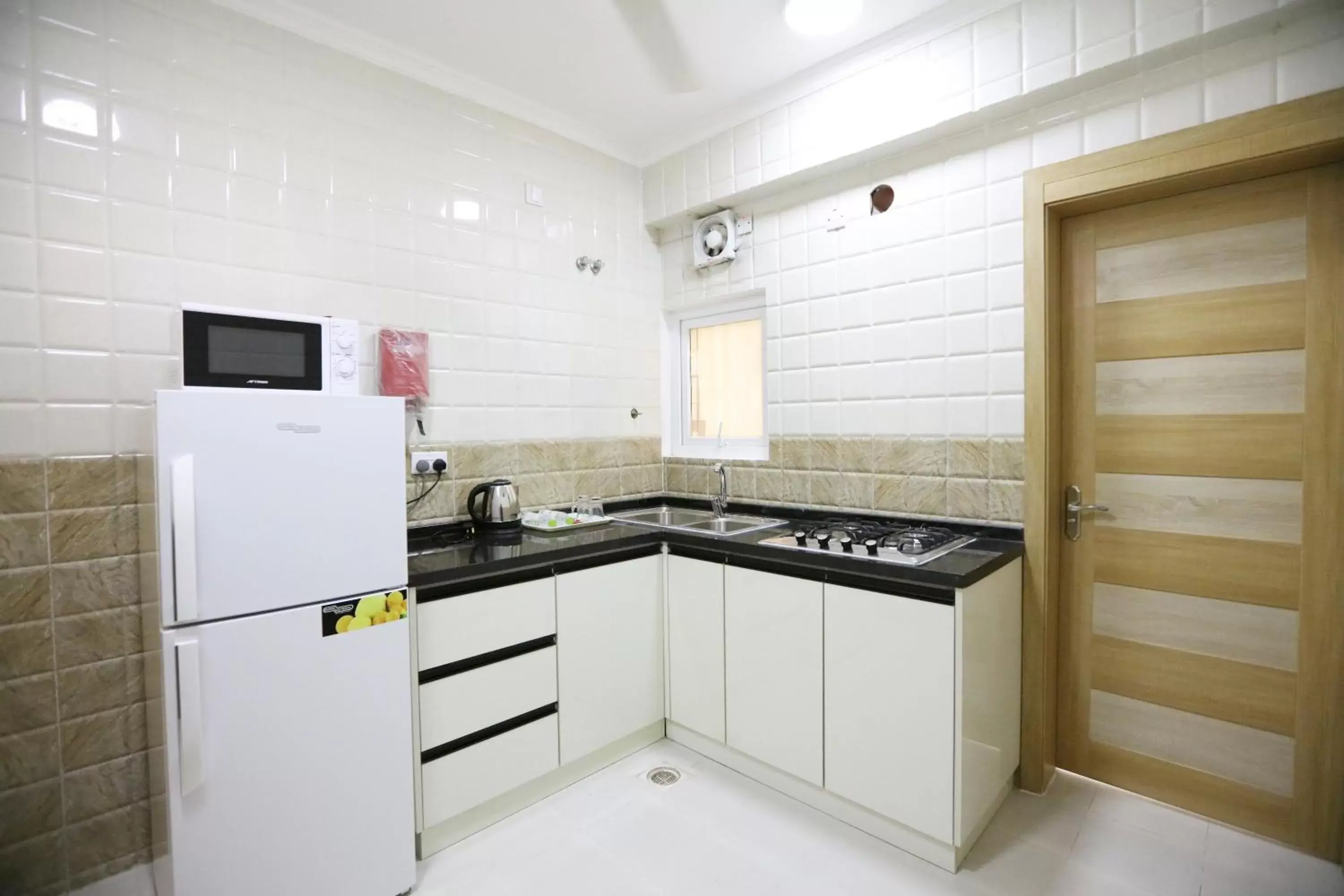 Kitchen or kitchenette in Al Rayyan Hotel Apartments Muscat Kitchen or kitchenette in Al Rayyan Hotel Apartments Muscat