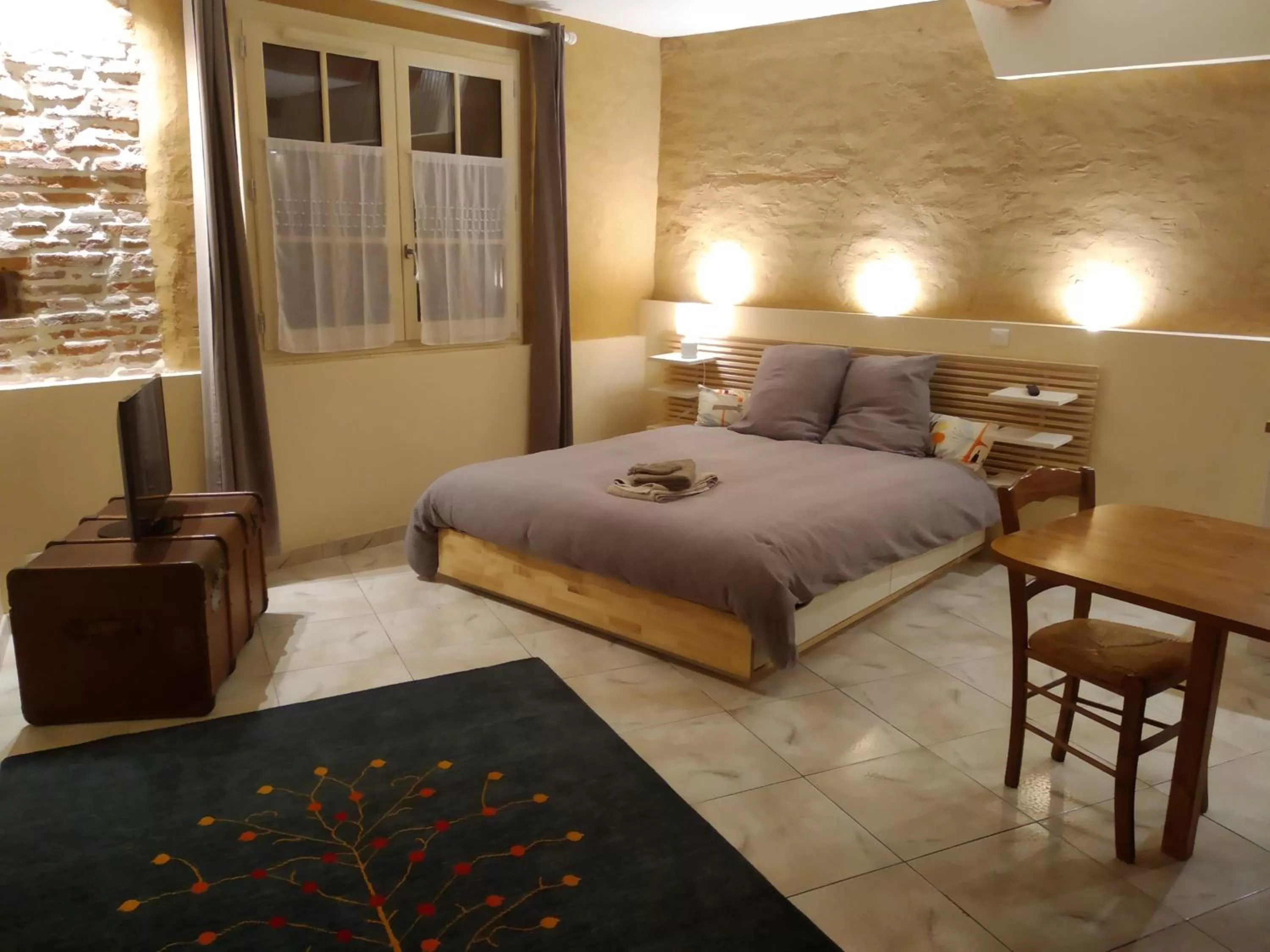 Bed in Au coeur de Montastruc-la-Conseillère - Chambres d'hôtes