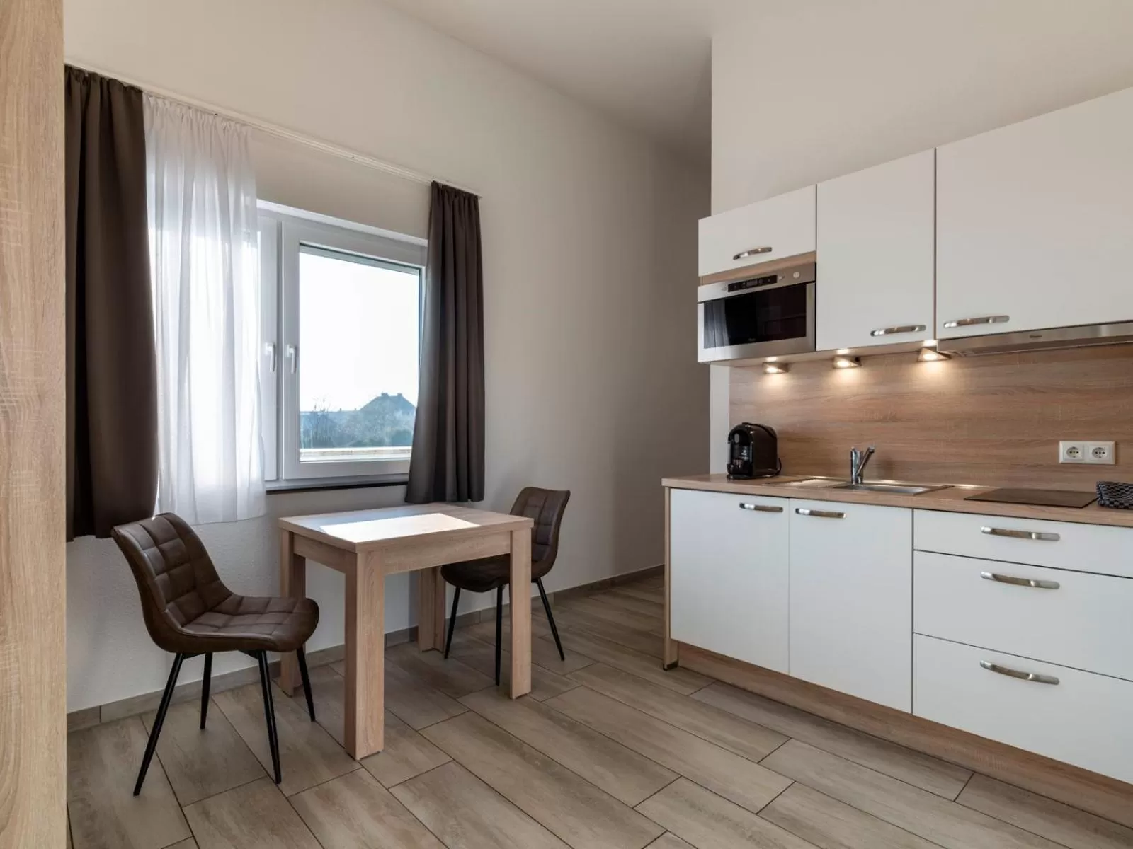 Kitchen or kitchenette in GLEUEL INN - digital hotel & serviced apartments & boardinghouse mit voll ausgestatteten Küchen