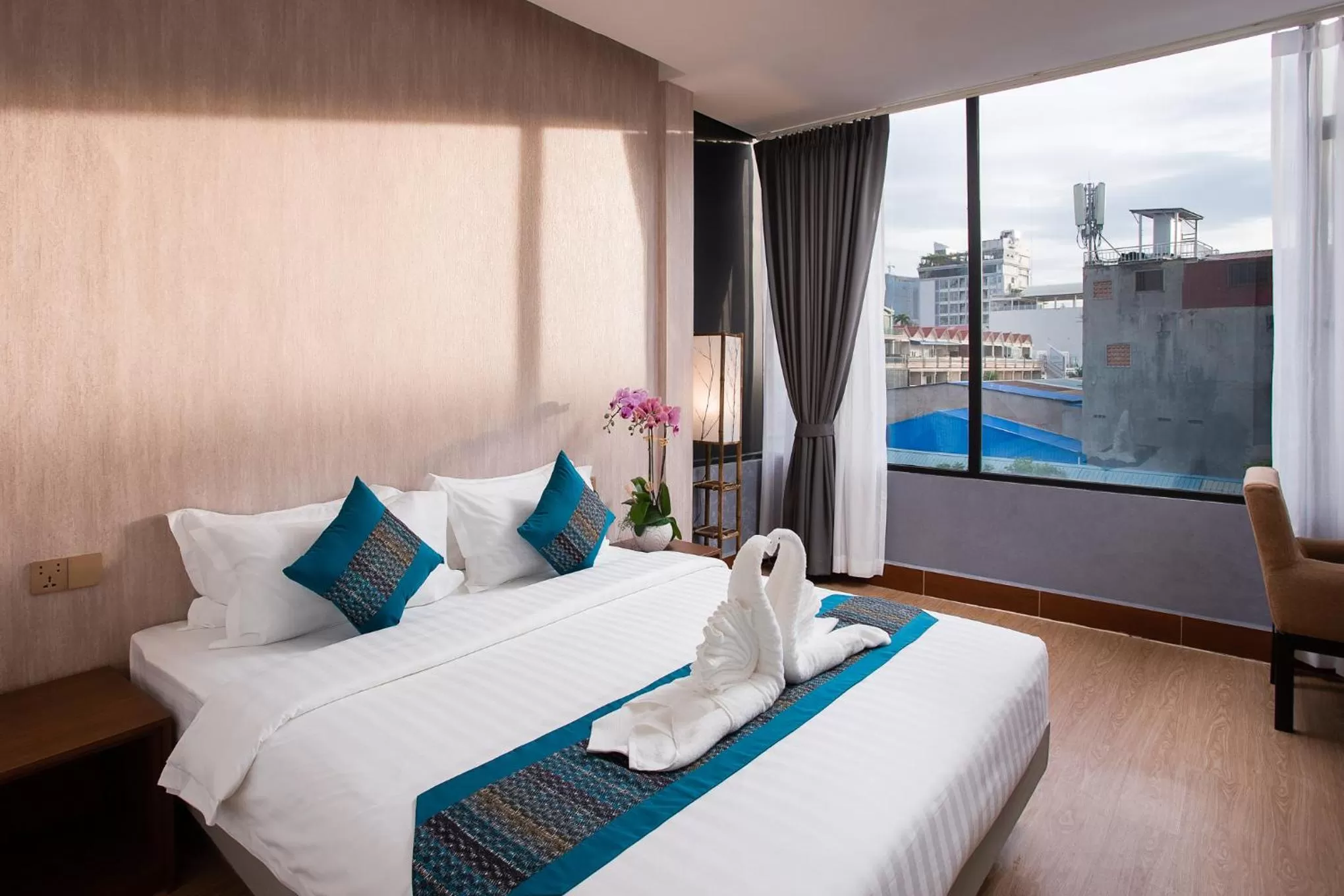 Photo of the whole room, Bed in Orussey One Boutique