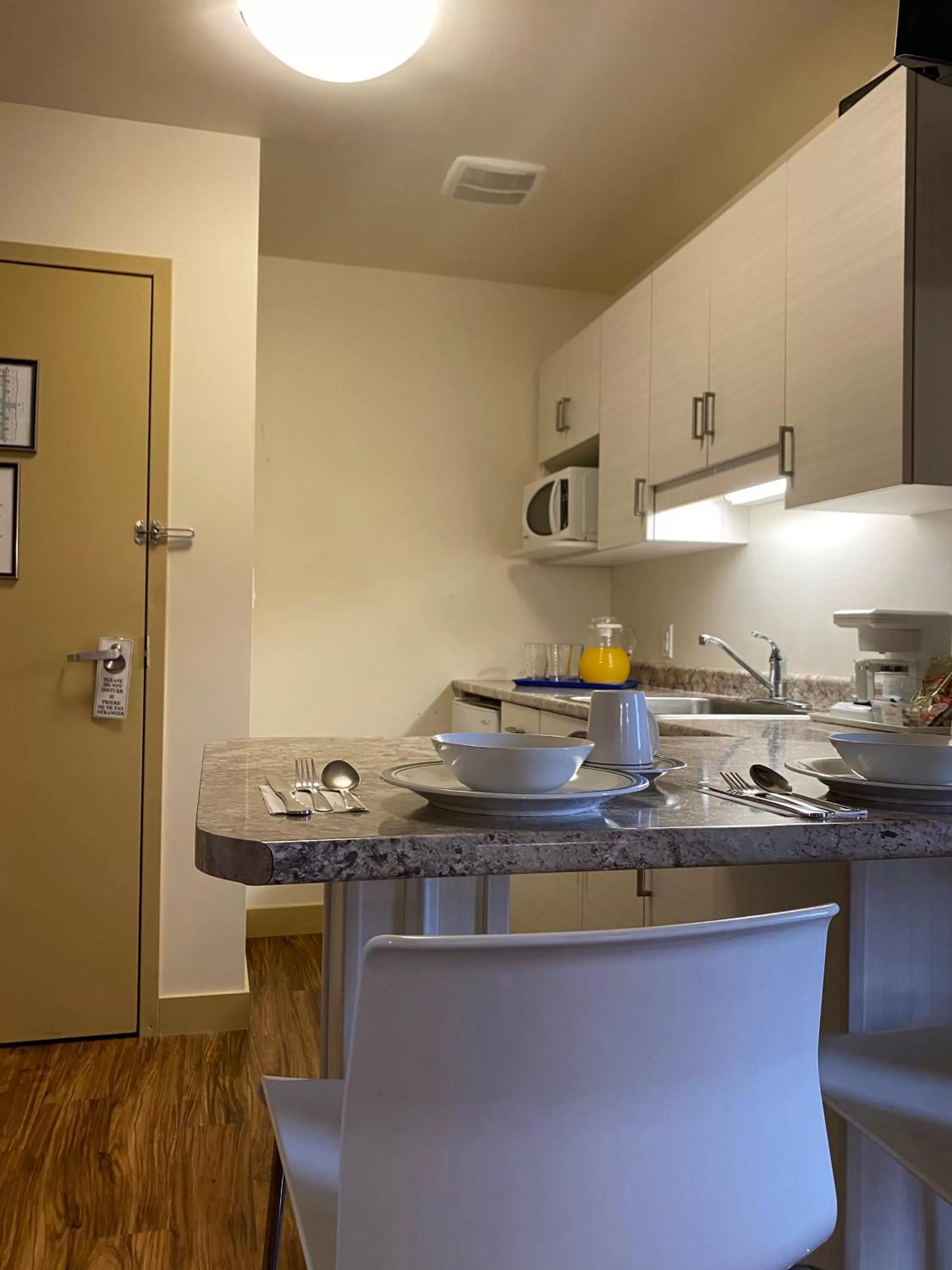 Kitchen or kitchenette in Sleep Suite Motel