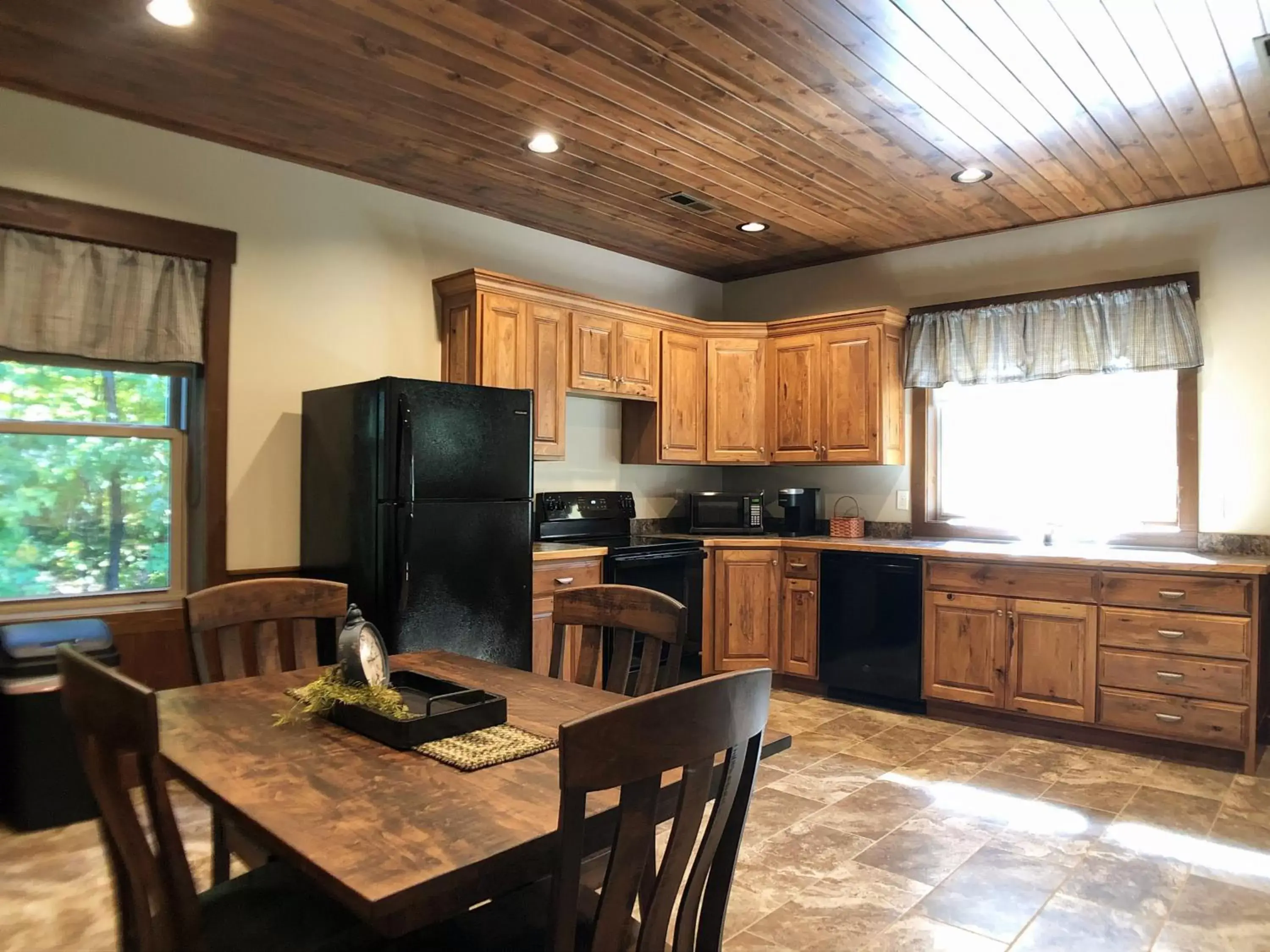 Kitchen/Kitchenette in Sojourner's Lodge & Log Cabin Suites