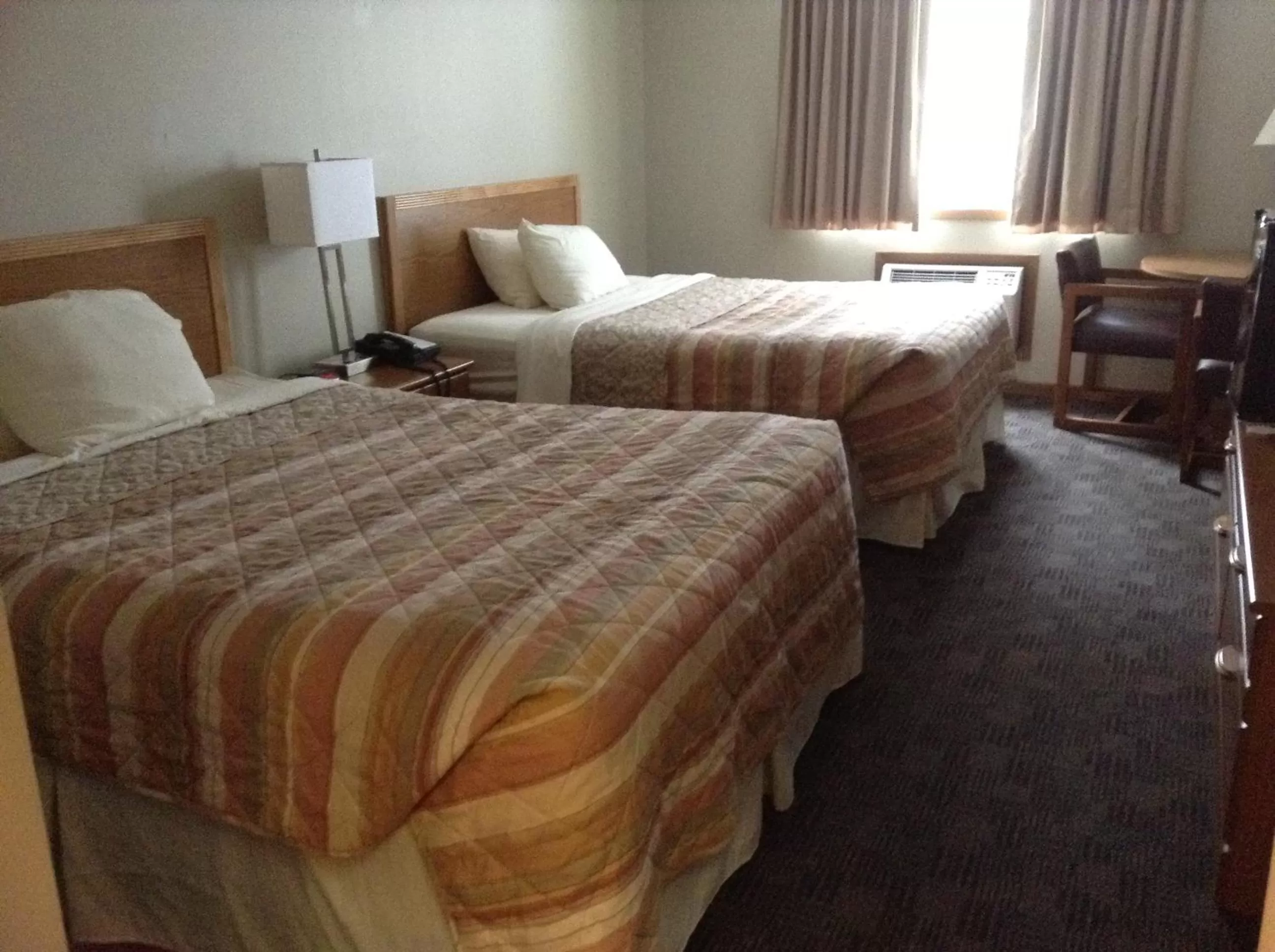 Bedroom, Bed in SunRise Inn Hotel