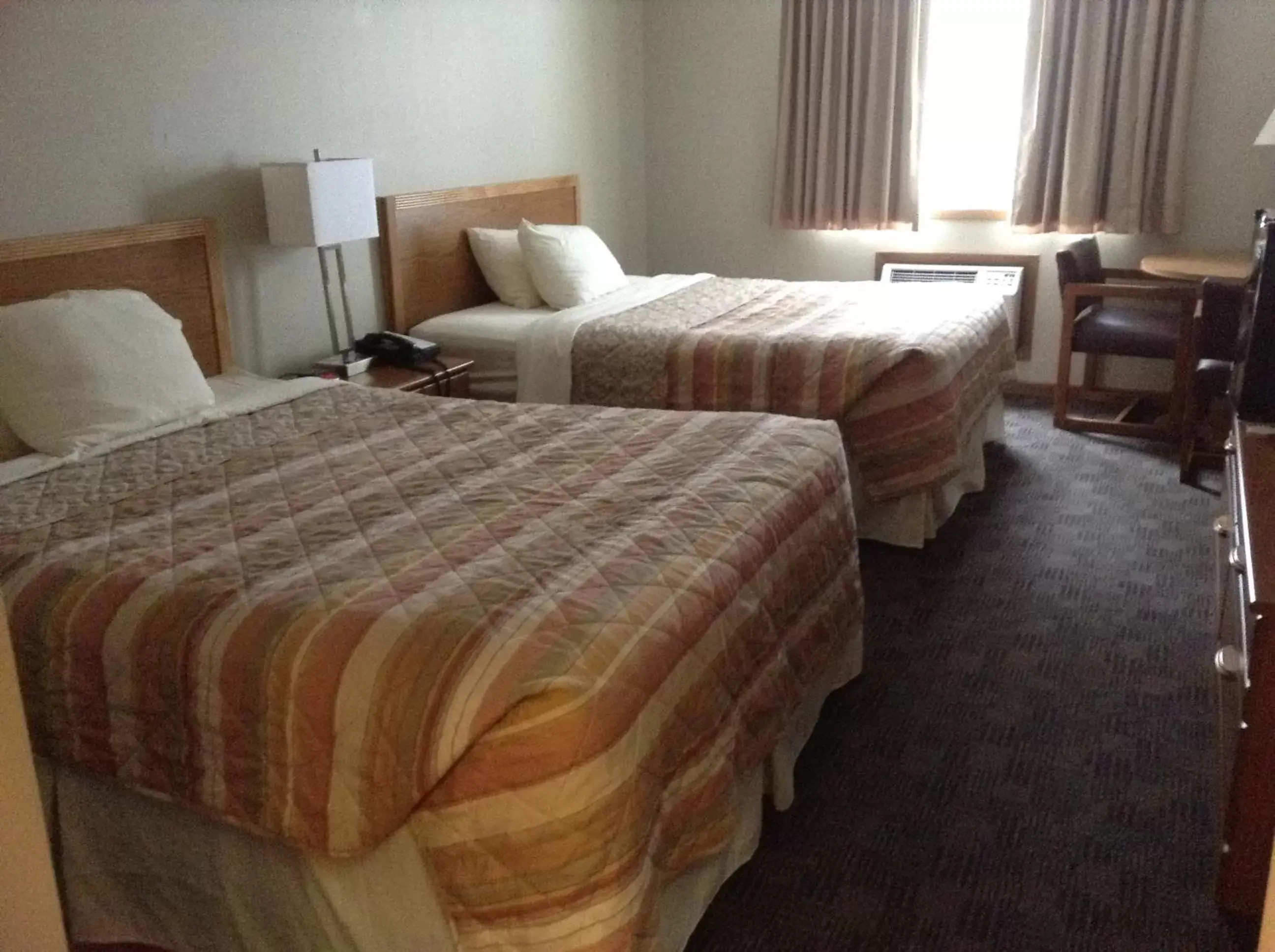 Bedroom, Bed in SunRise Inn Hotel