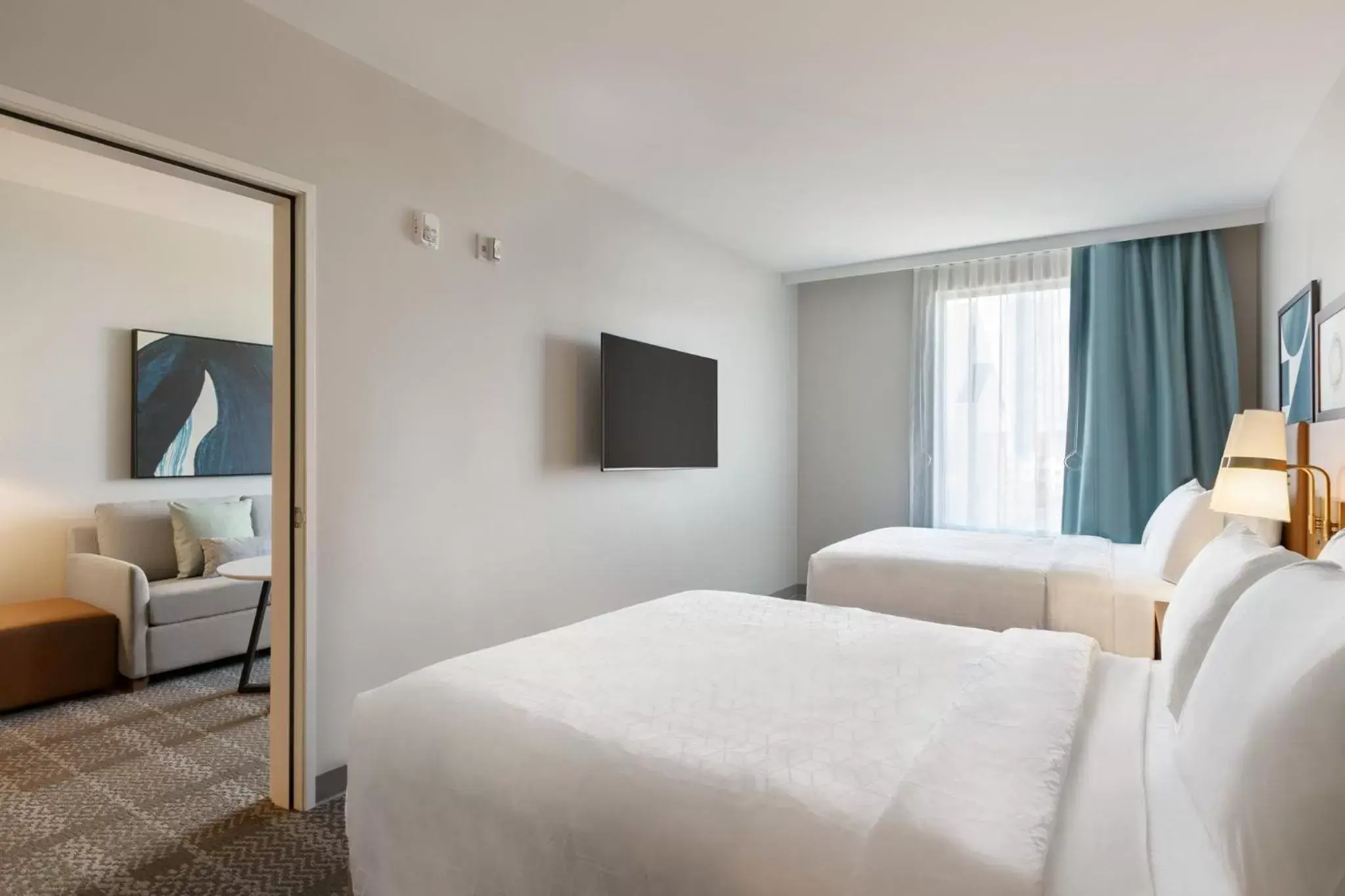 Photo of the whole room, Bed in Staybridge Suites Rochester - Mayo Clinic Area, an IHG Hotel