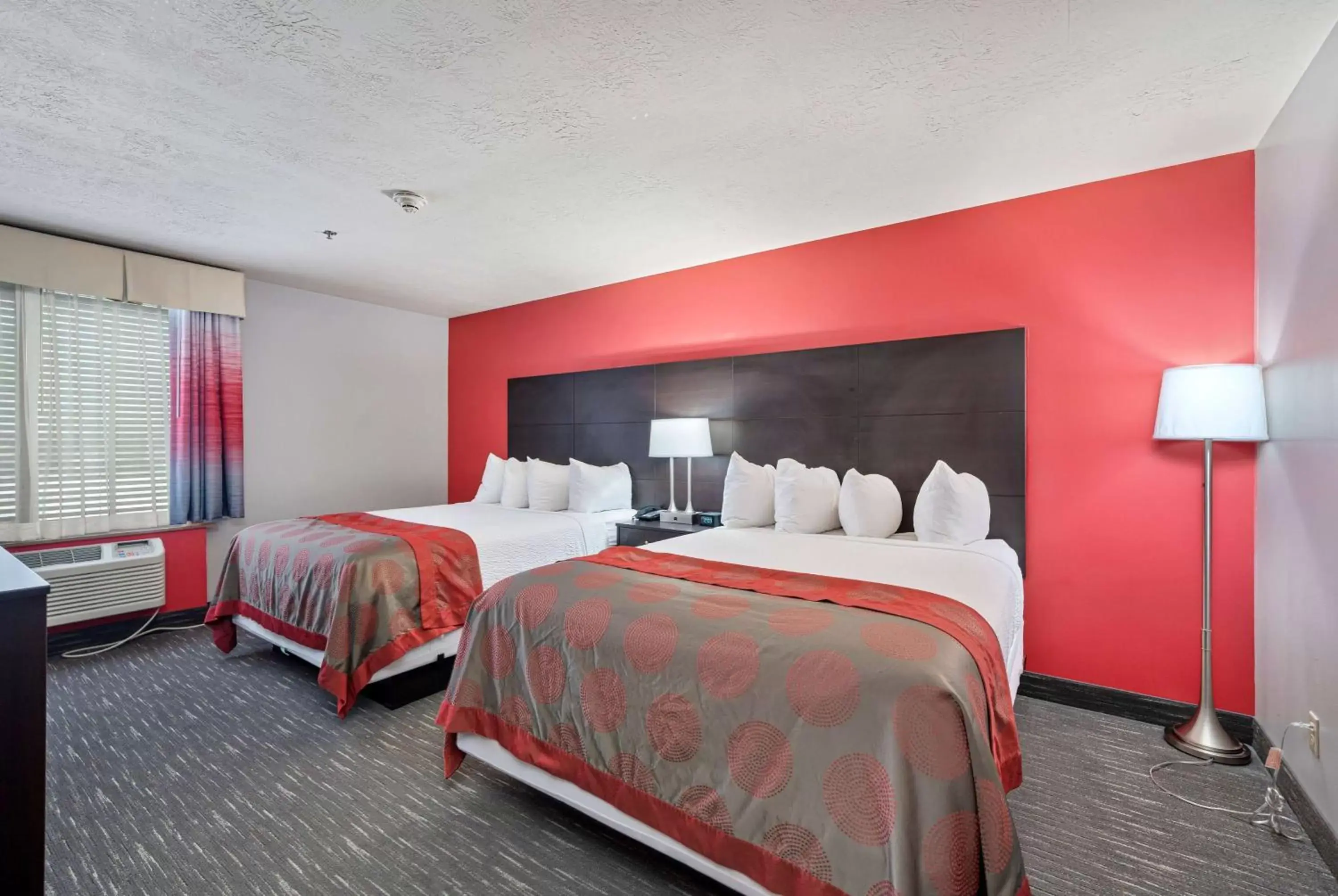 Photo of the whole room, Bed in Ramada by Wyndham Sioux Falls Airport - Waterpark Resort & Event Center