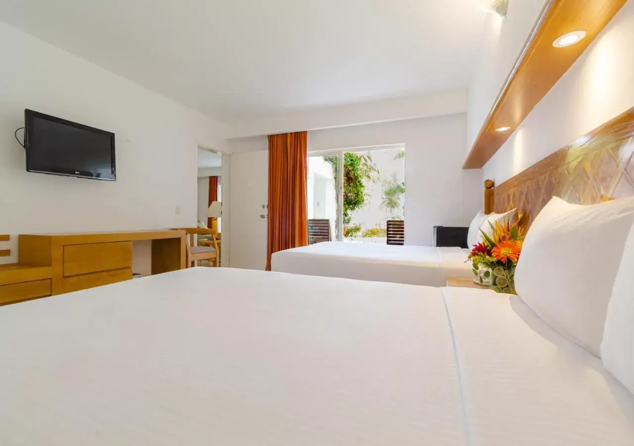 Bed in Beachscape Kin Ha Villas & Suites