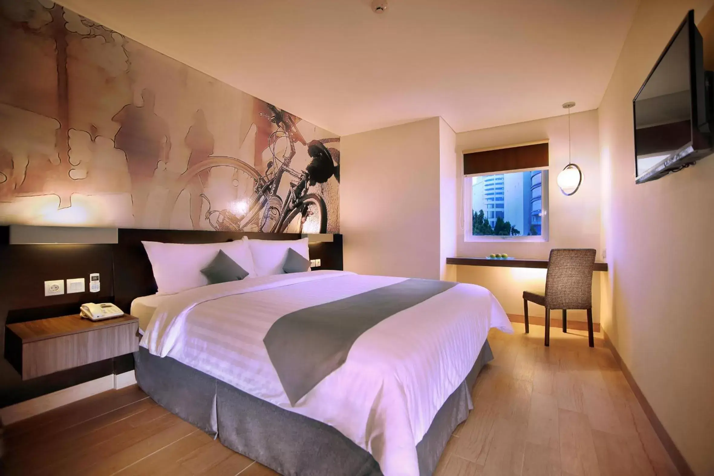 Bed in Neo Hotel Mangga Dua by ASTON