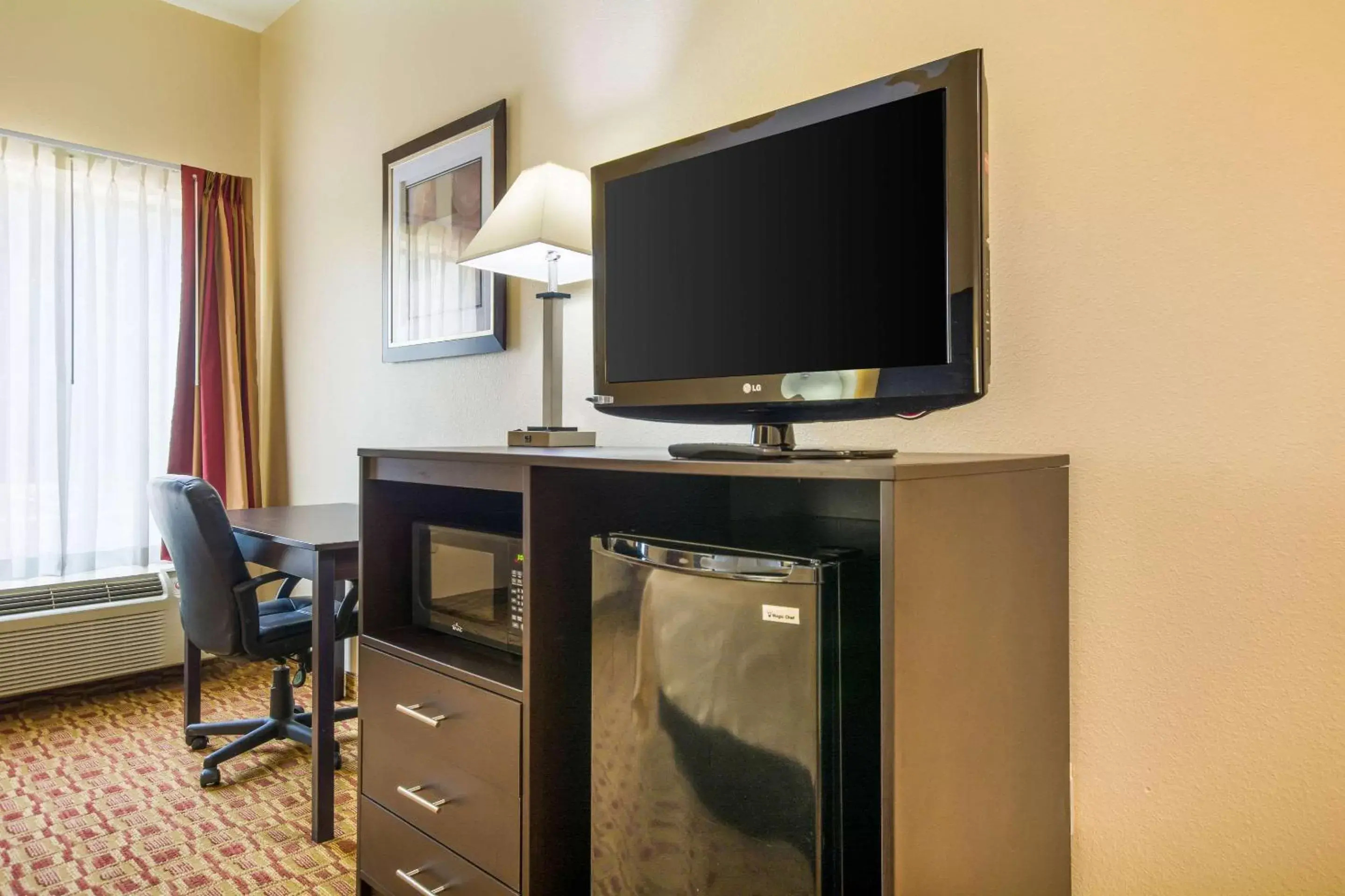 Photo of the whole room, TV/Entertainment Center in Quality Inn & Suites-Sellersburg