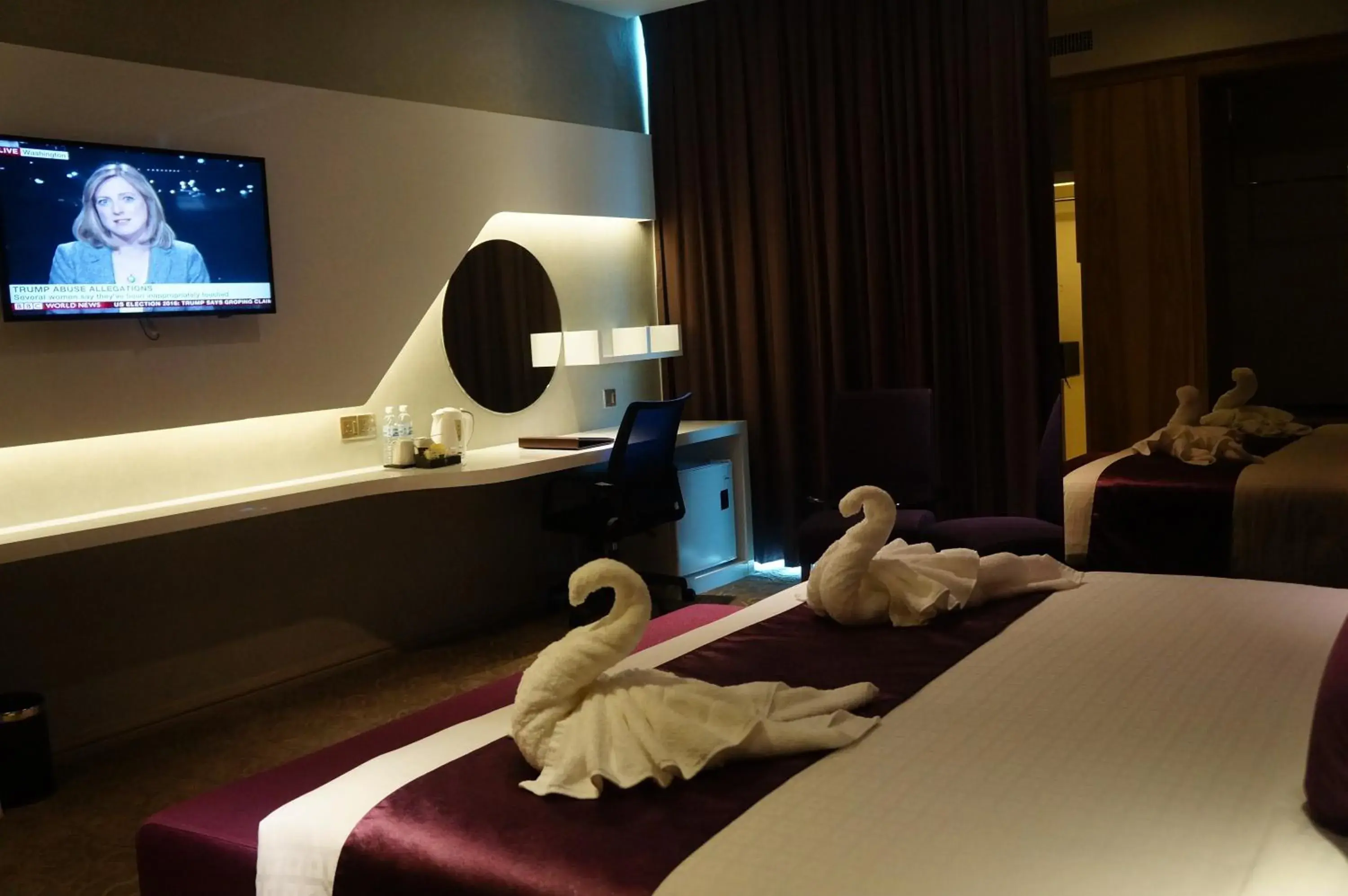 Bedroom, TV/Entertainment Center in Greens Hotel & Suites