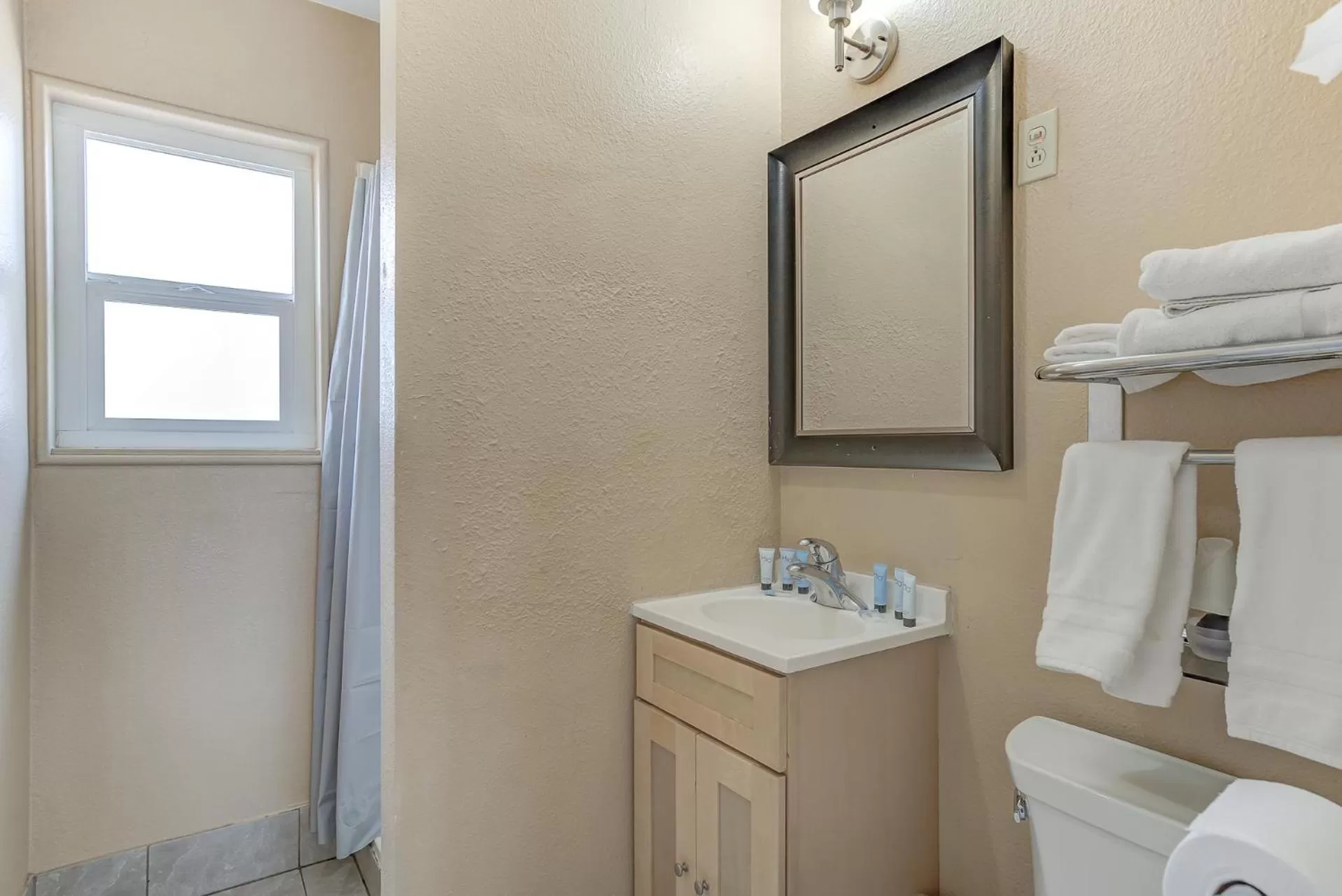 Toilet in Shasta Pines Motel & Suites