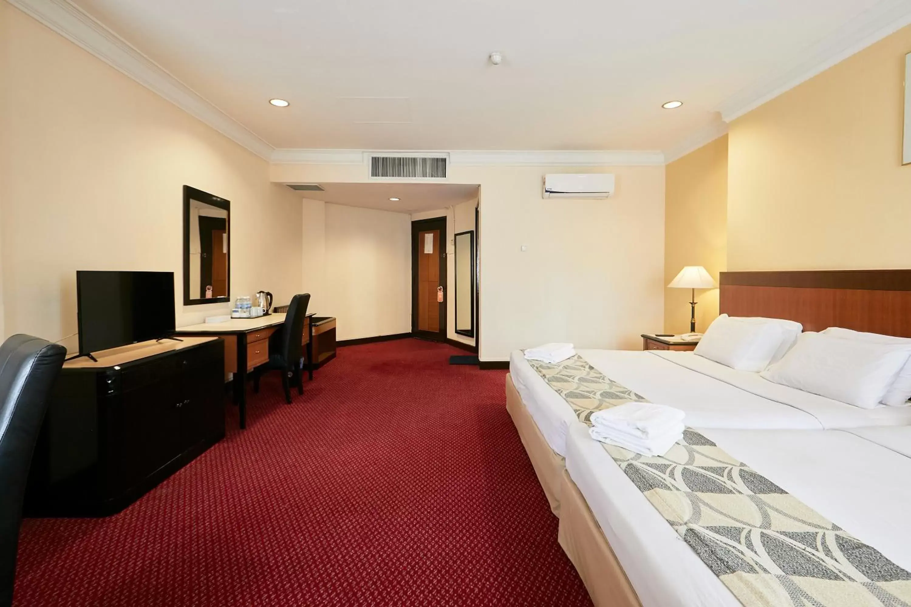 Bed in Grand Pacific Hotel