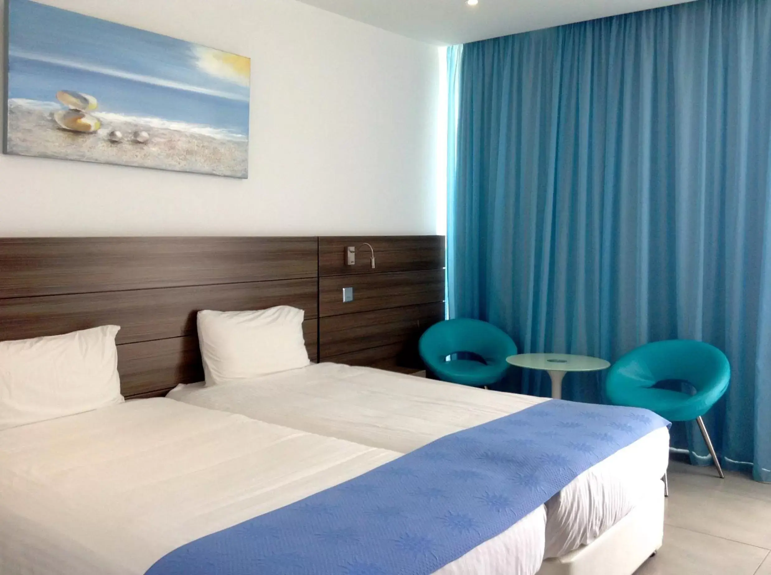 Photo of the whole room, Bed in Limanaki Beach Hotel & Suites